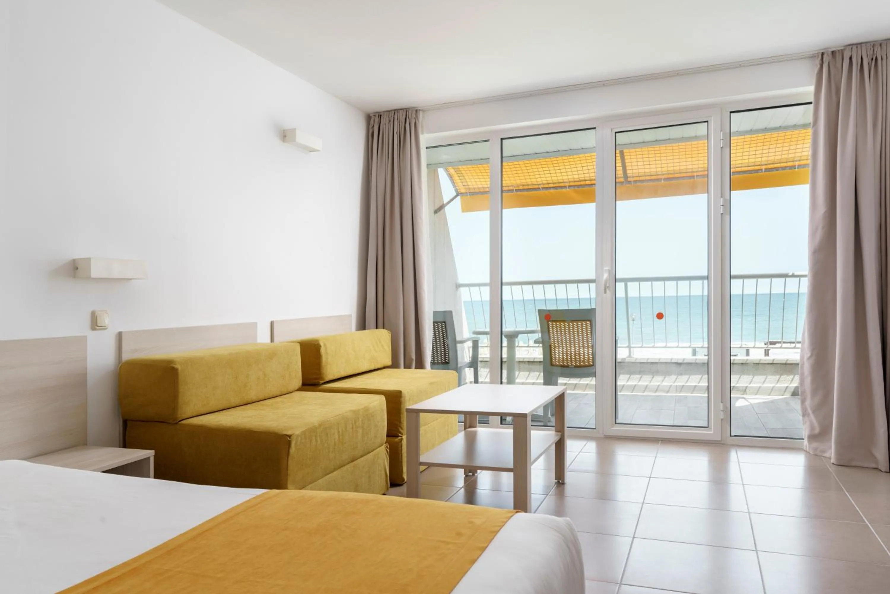 Seating area, Bed in AluaSun Helios Beach - All Inclusive