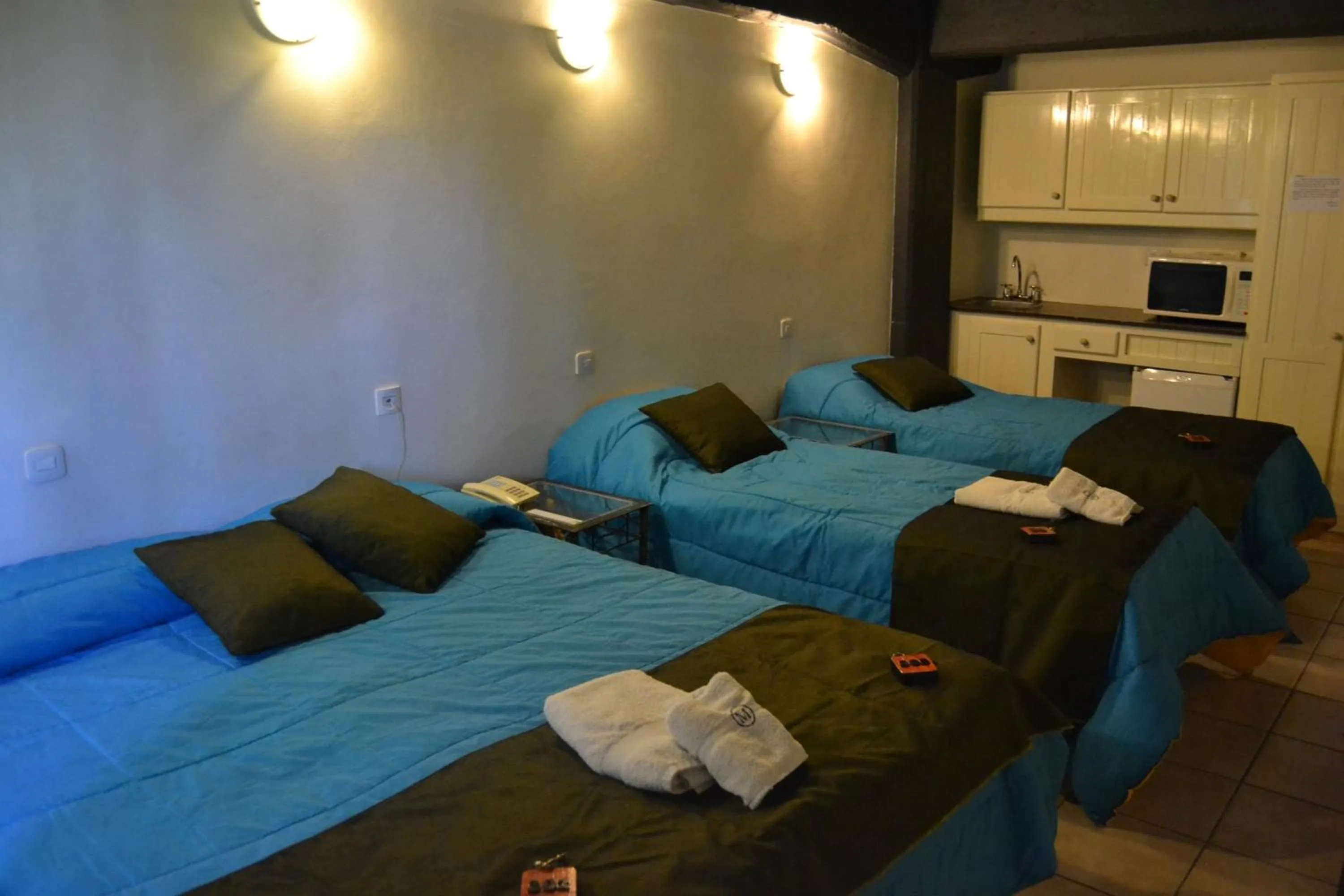 Photo of the whole room, Bed in Plaza Milenium