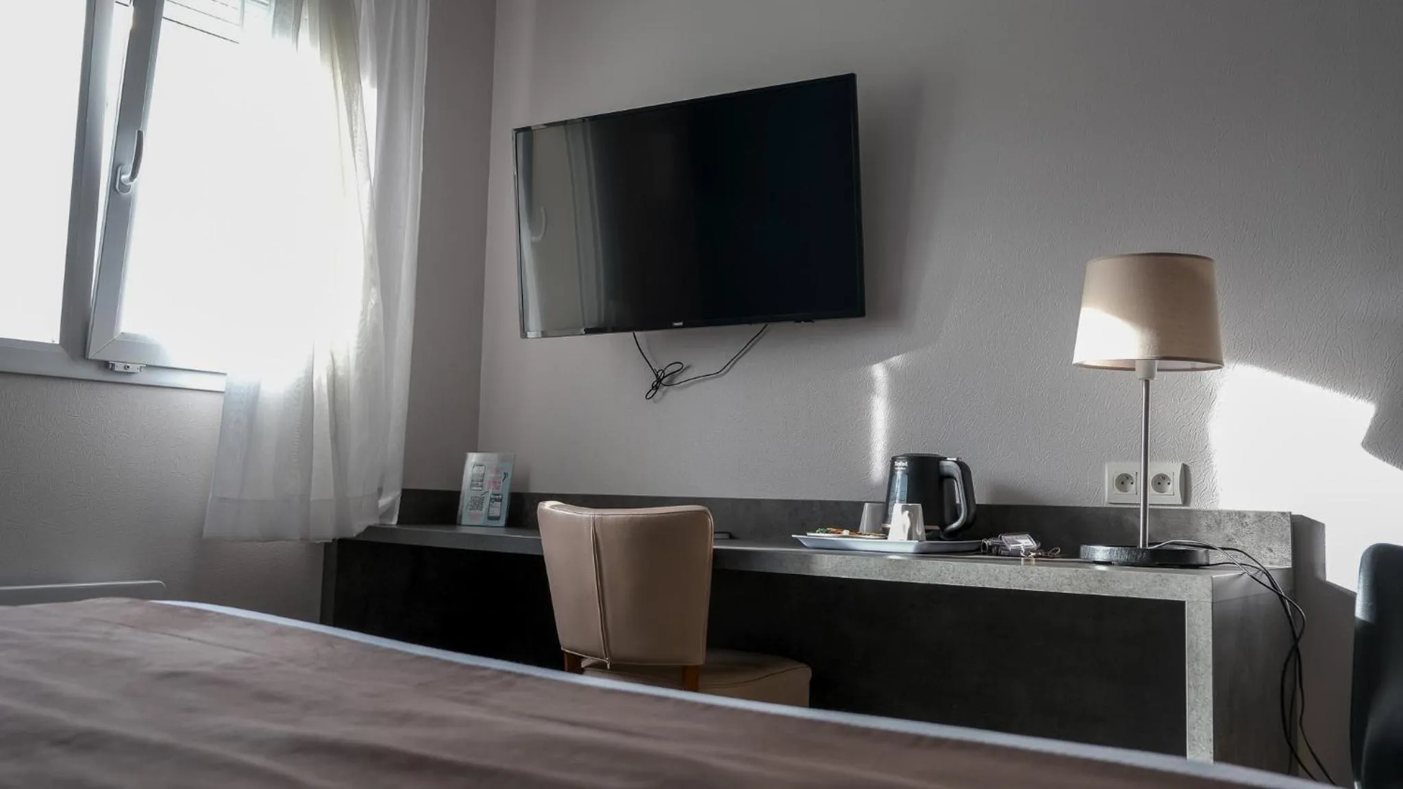 Bed in LOGIS Hôtel ARCADIA