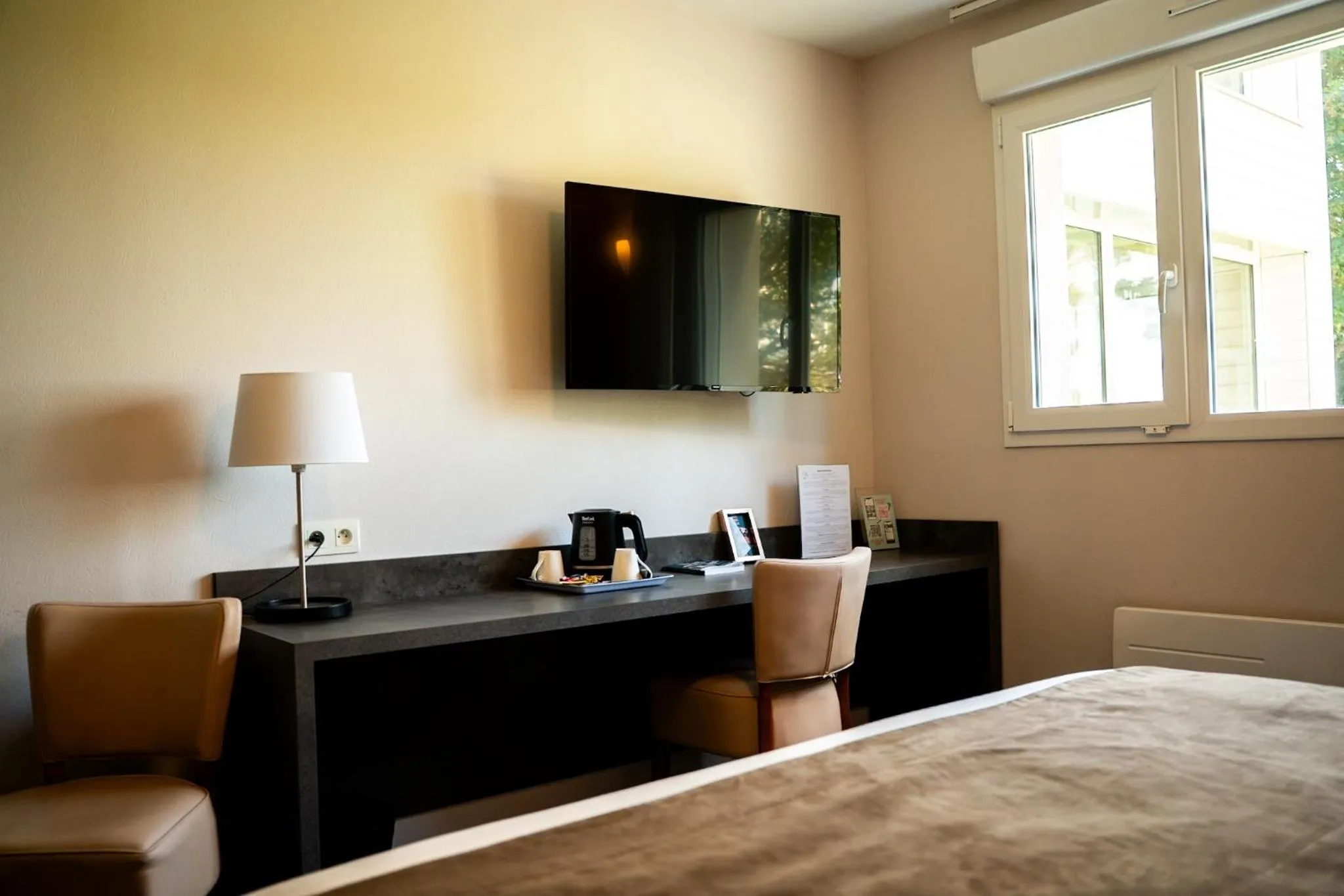 Bed in LOGIS Hôtel ARCADIA