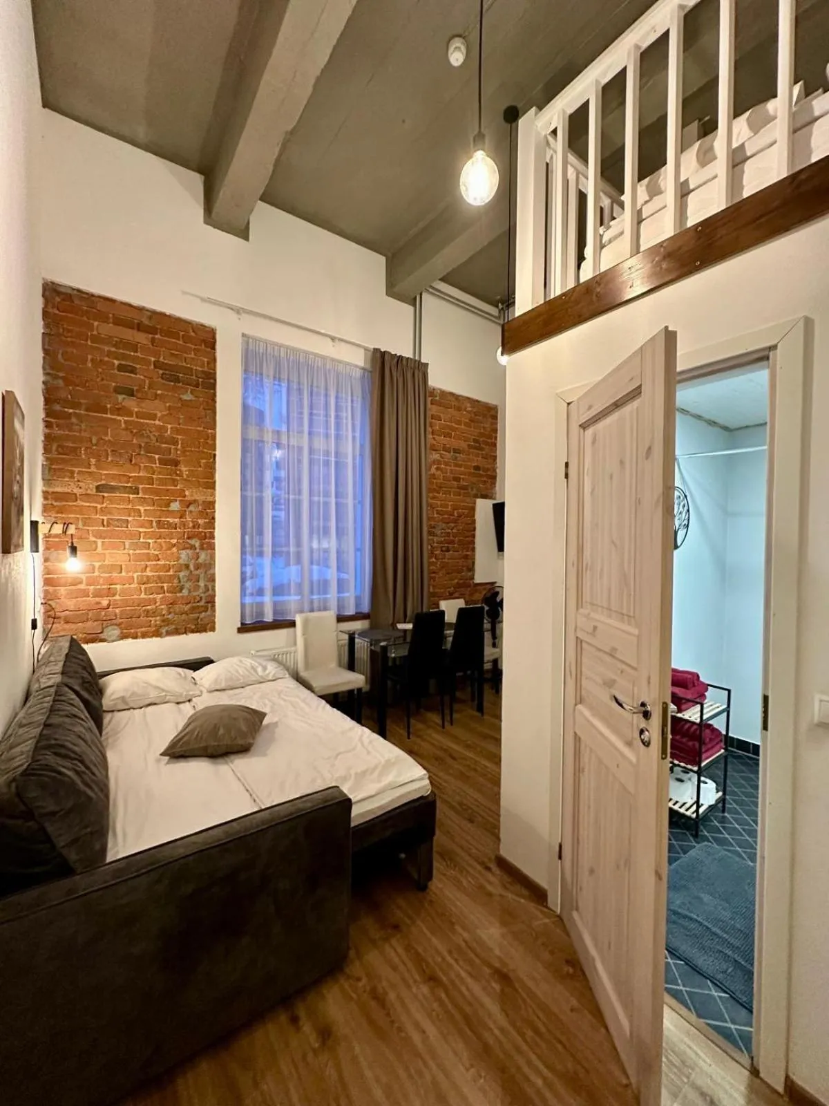 Living room, Bed in Filosoofi 1 Studio Apartments