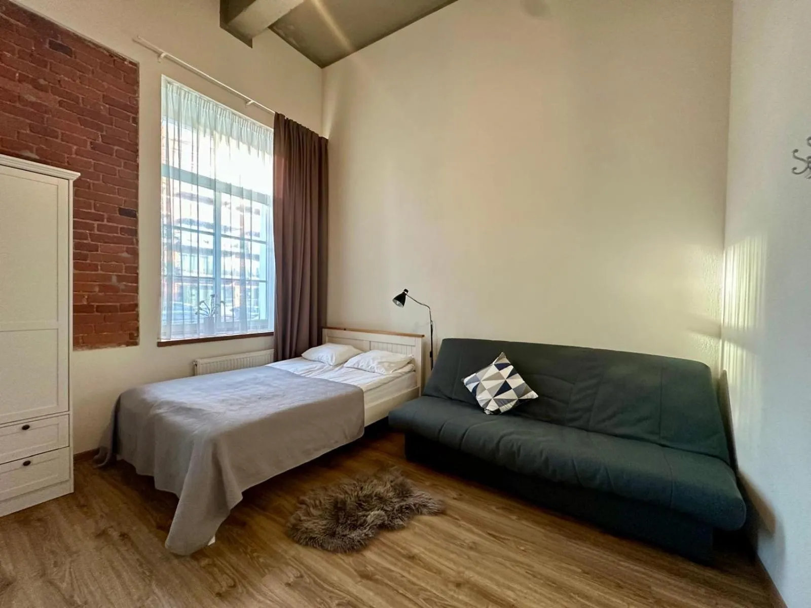 Bed in Filosoofi 1 Studio Apartments