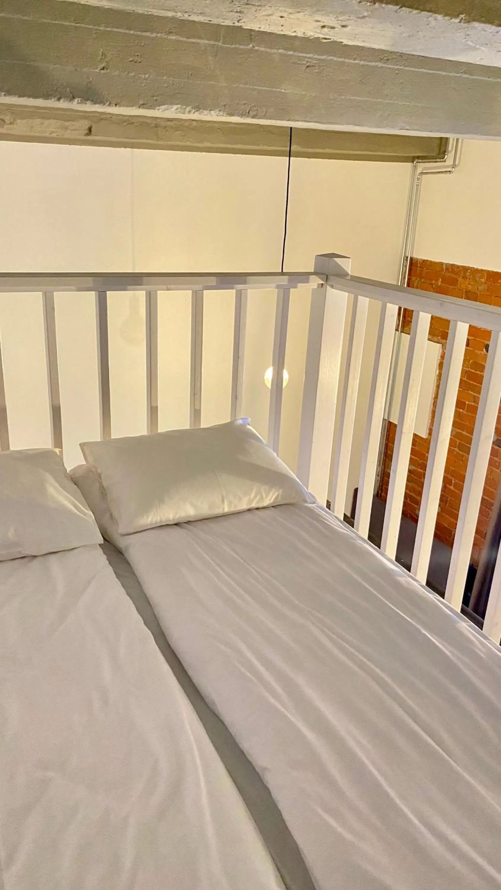 Bed in Filosoofi 1 Studio Apartments