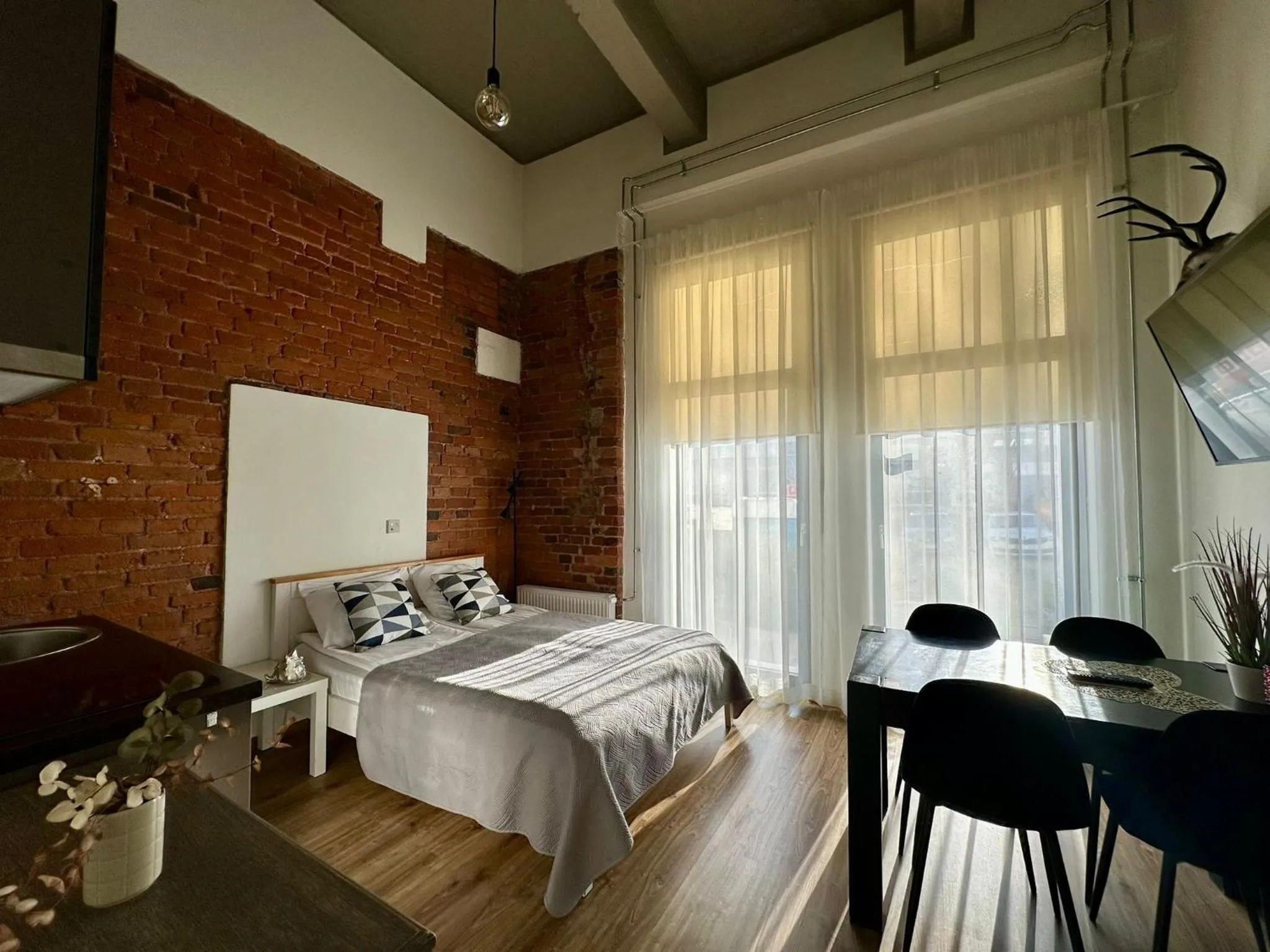 Bed in Filosoofi 1 Studio Apartments