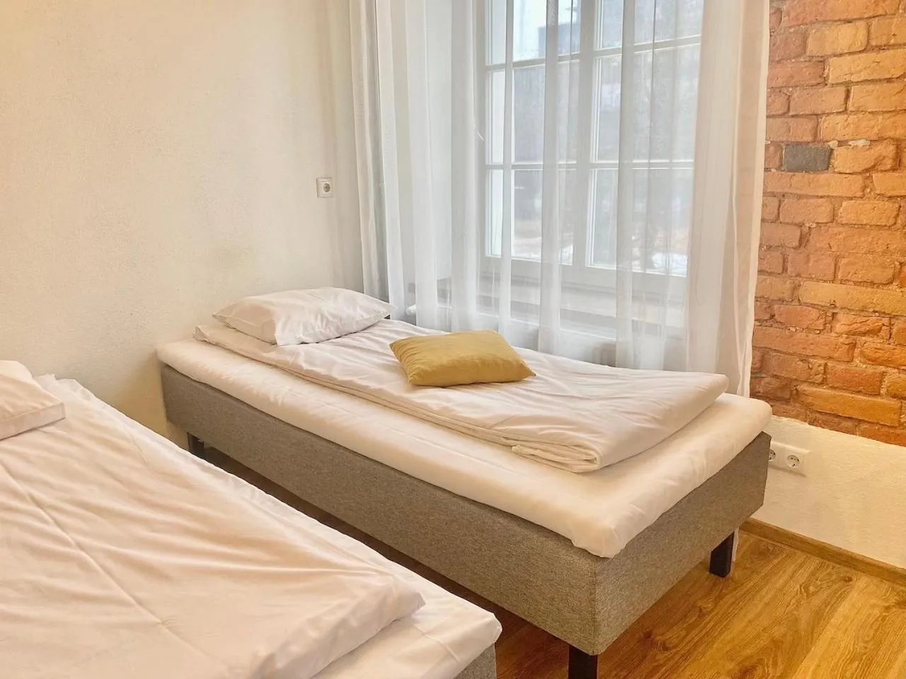Bed in Filosoofi 1 Studio Apartments