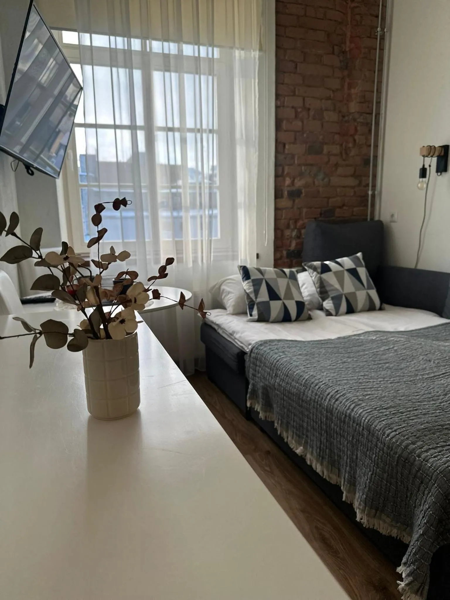 Bed in Filosoofi 1 Studio Apartments