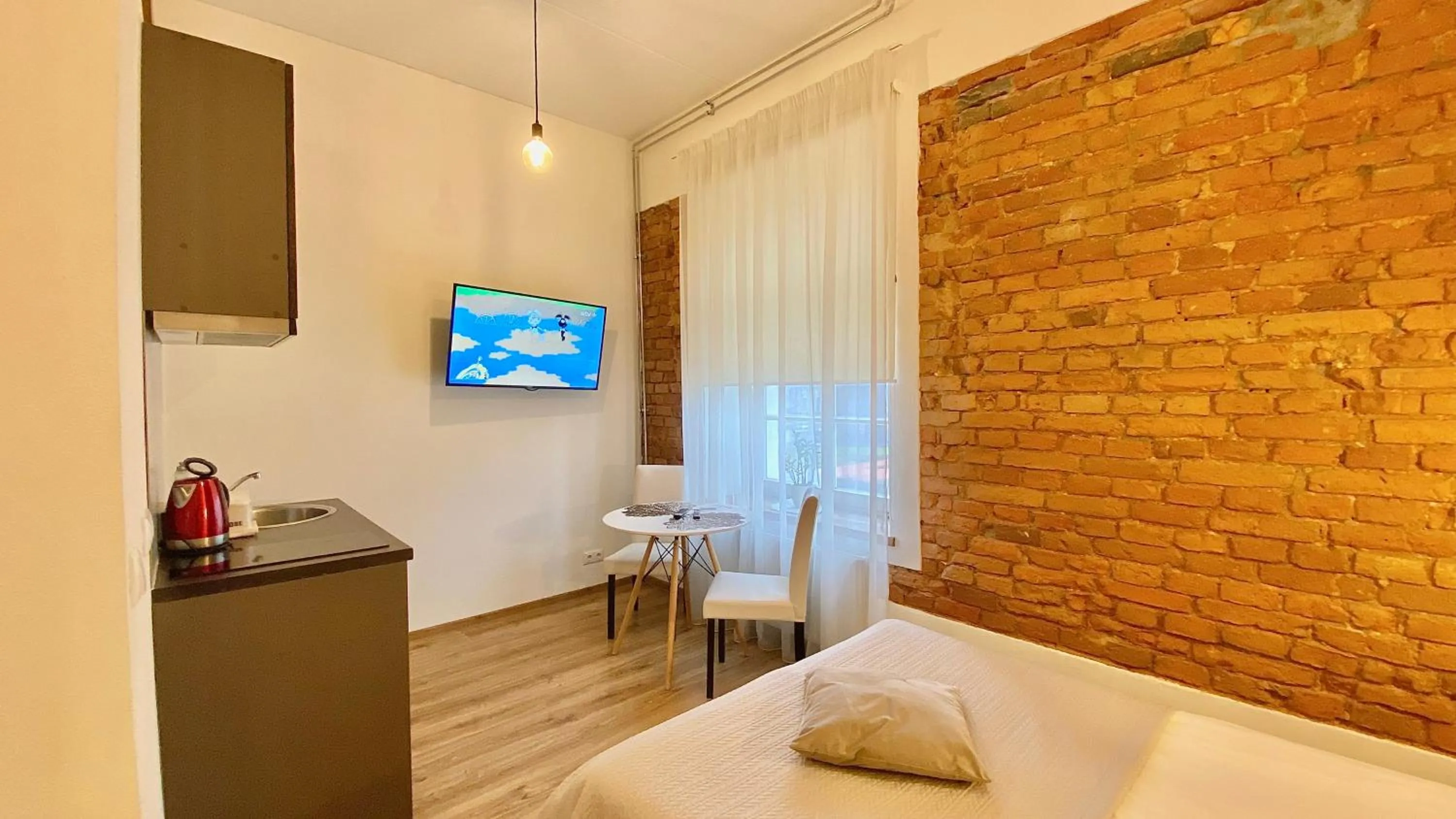TV and multimedia, Bed in Filosoofi 1 Studio Apartments