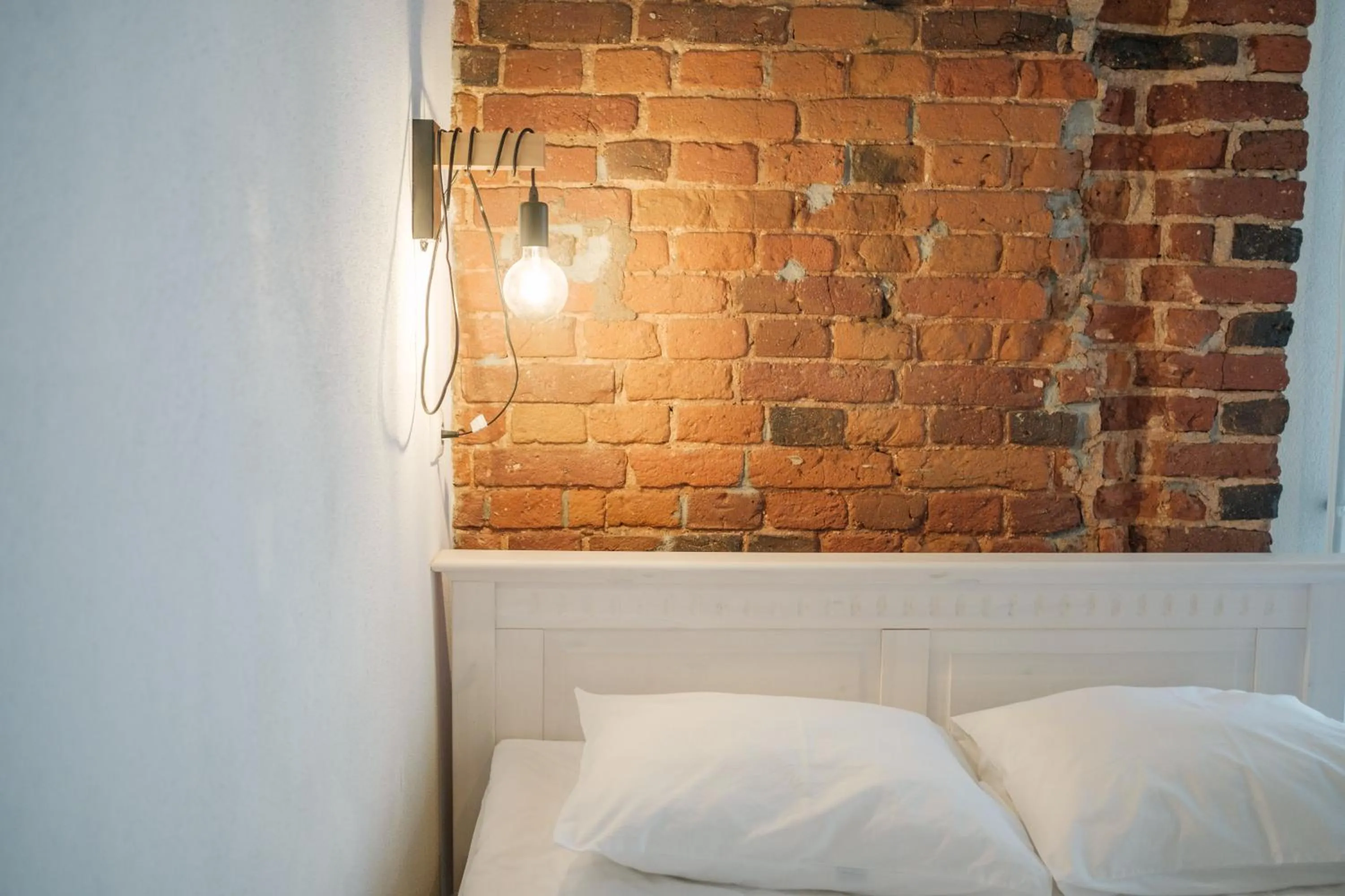 Bed in Filosoofi 1 Studio Apartments