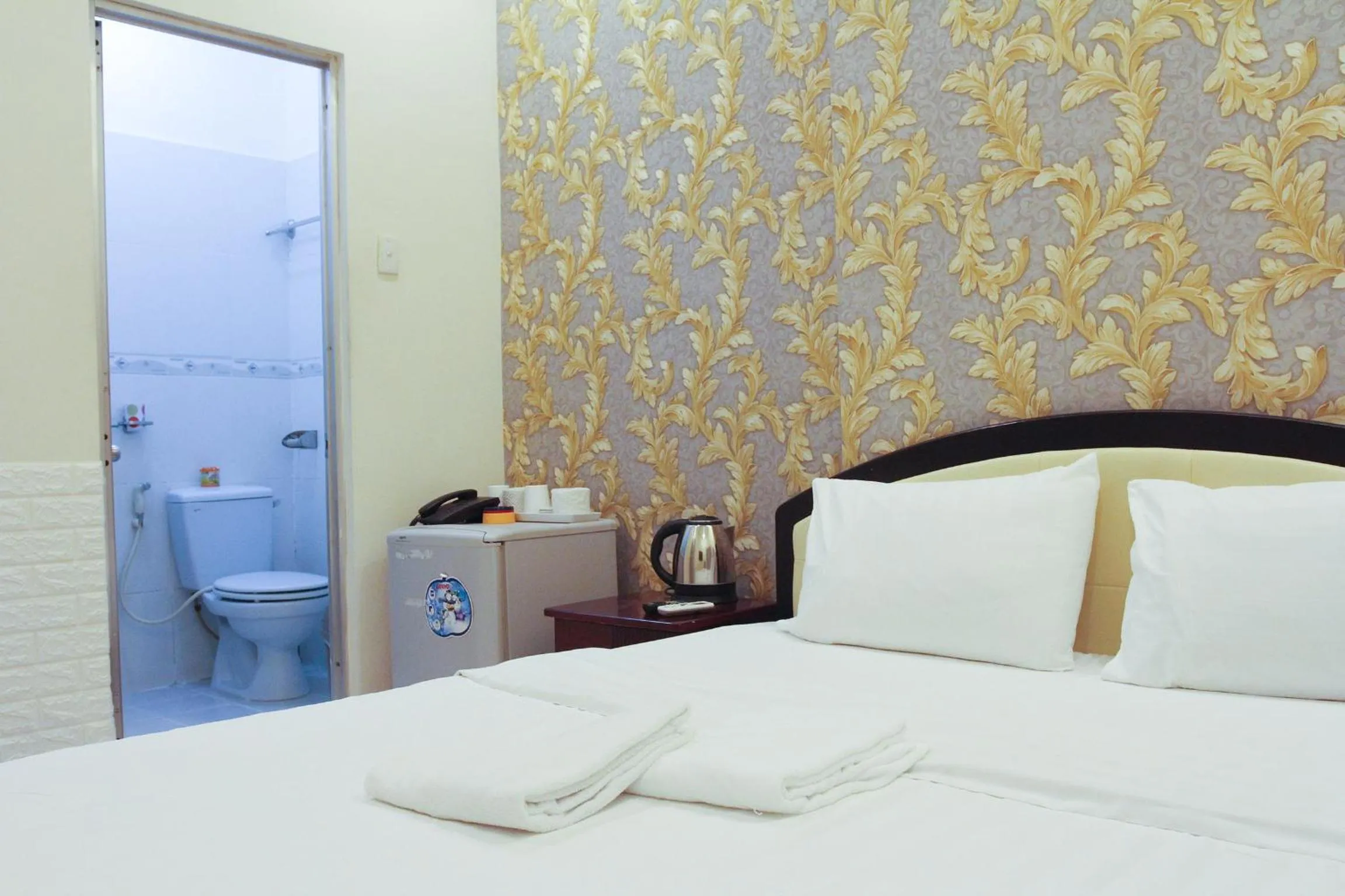 Toilet, Bed in Violet Star Hotel and Spa