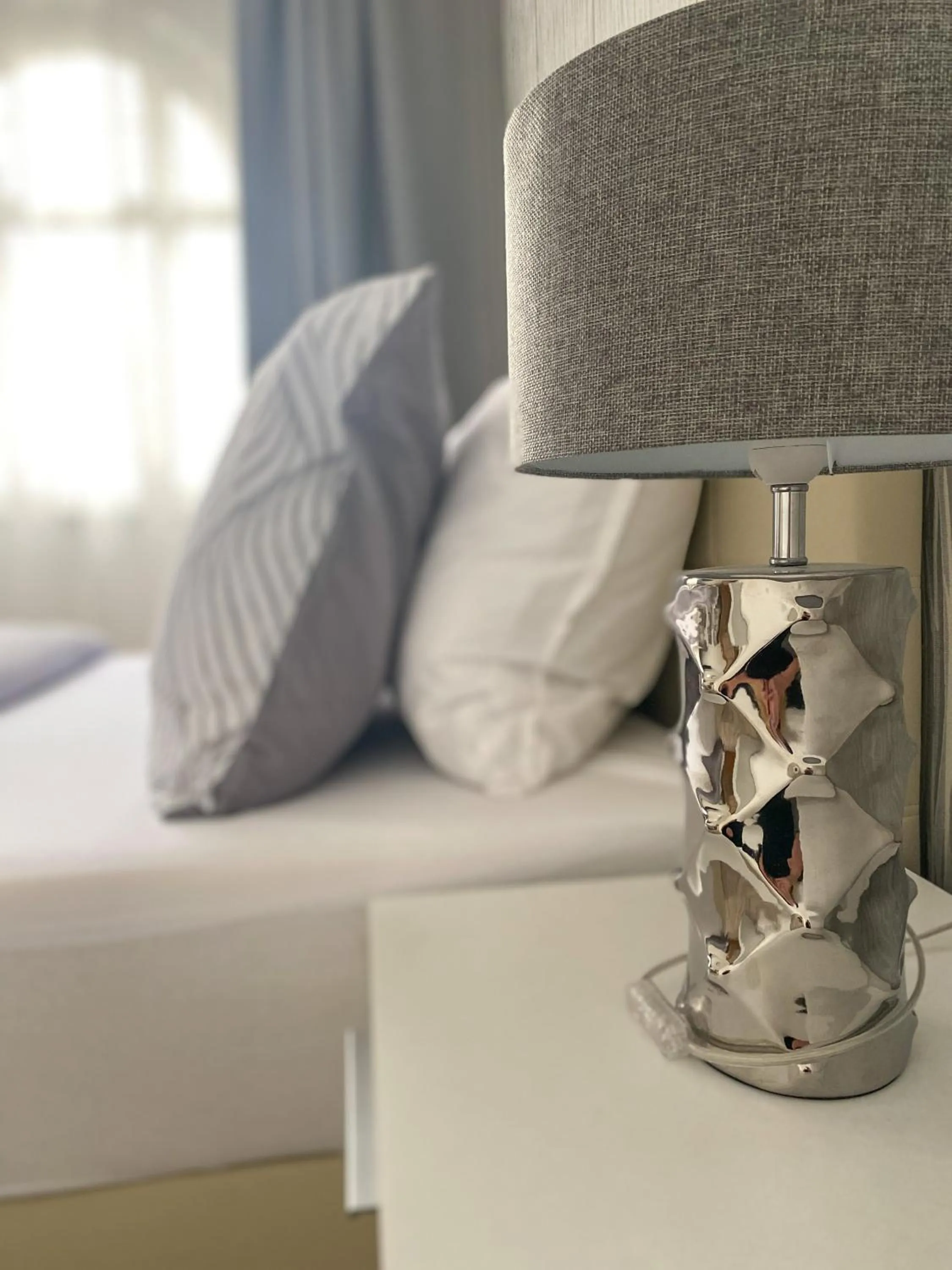 Bed in GrandLux Villa & Spa