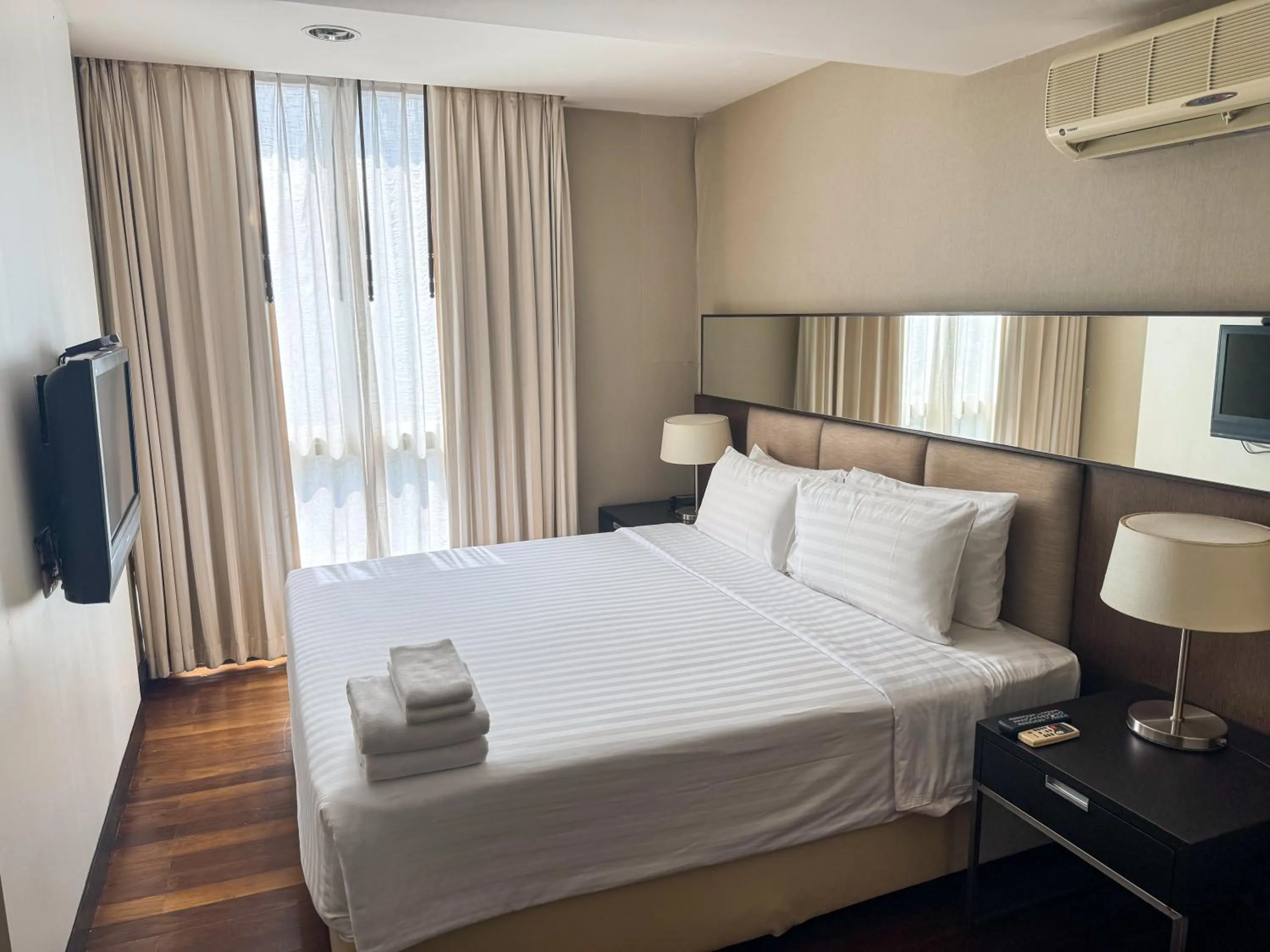 TV and multimedia, Bed in The Narathiwas Hotel & Residence Sathorn Bangkok