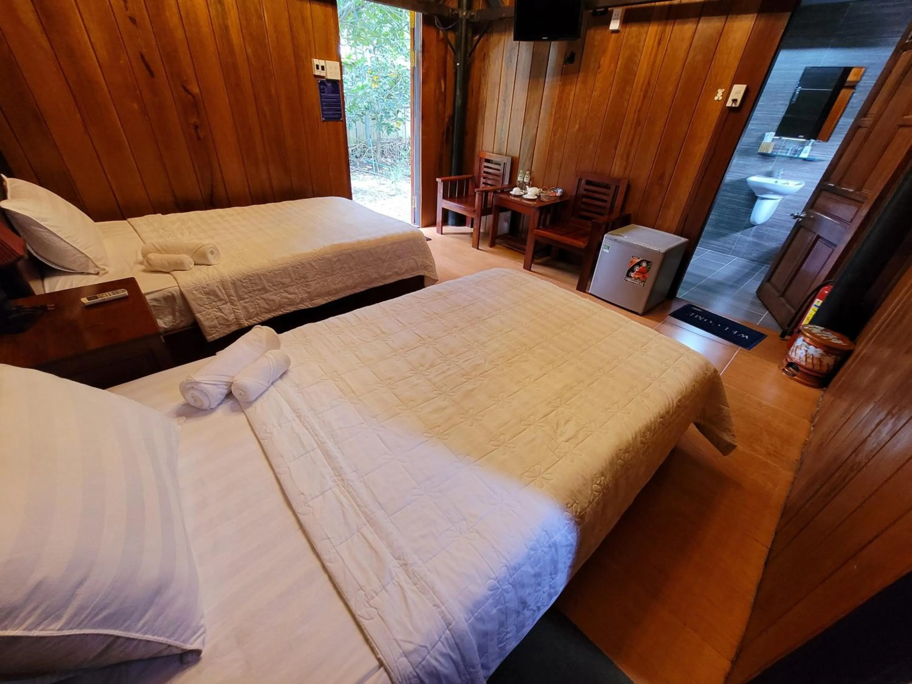 Bed in CASA ECO Mekong Resort