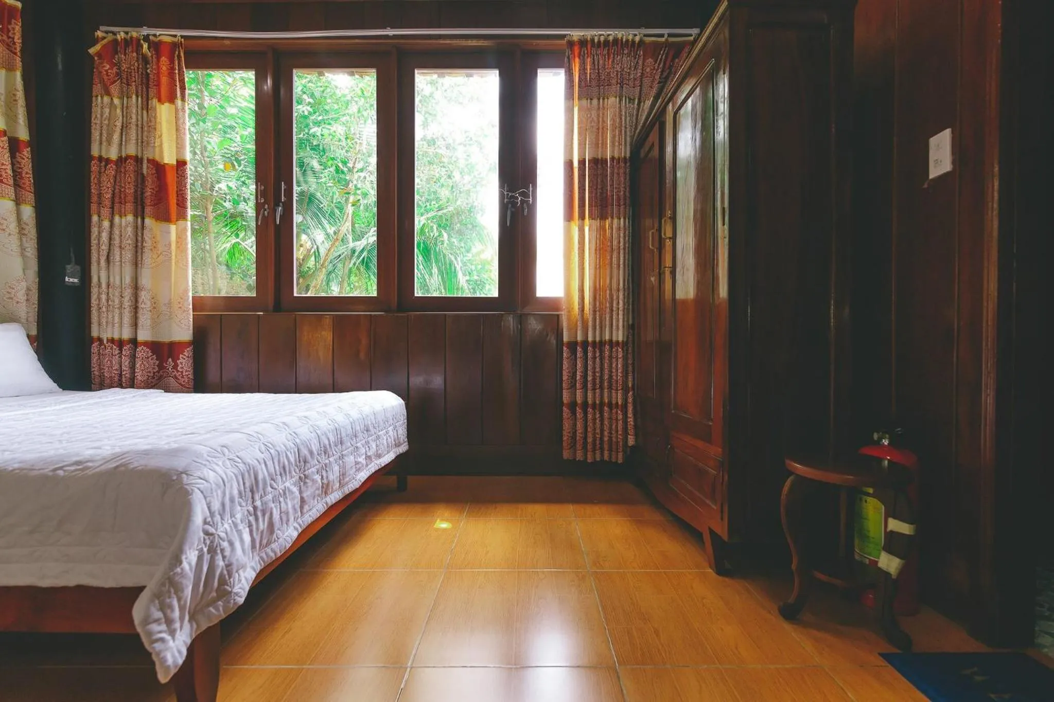 Bed in CASA ECO Mekong Resort