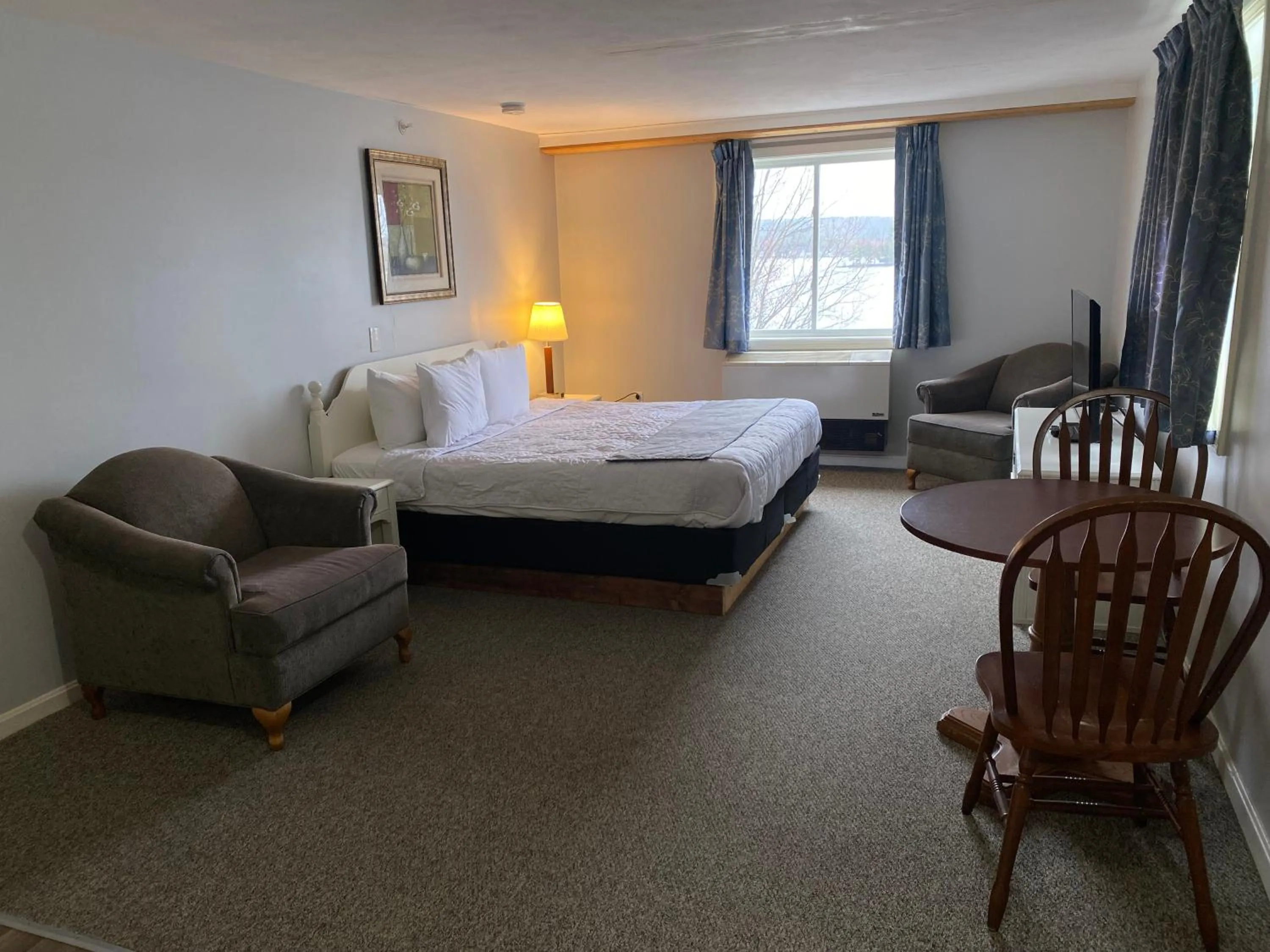 Bed in Winnisquam Lake Inn