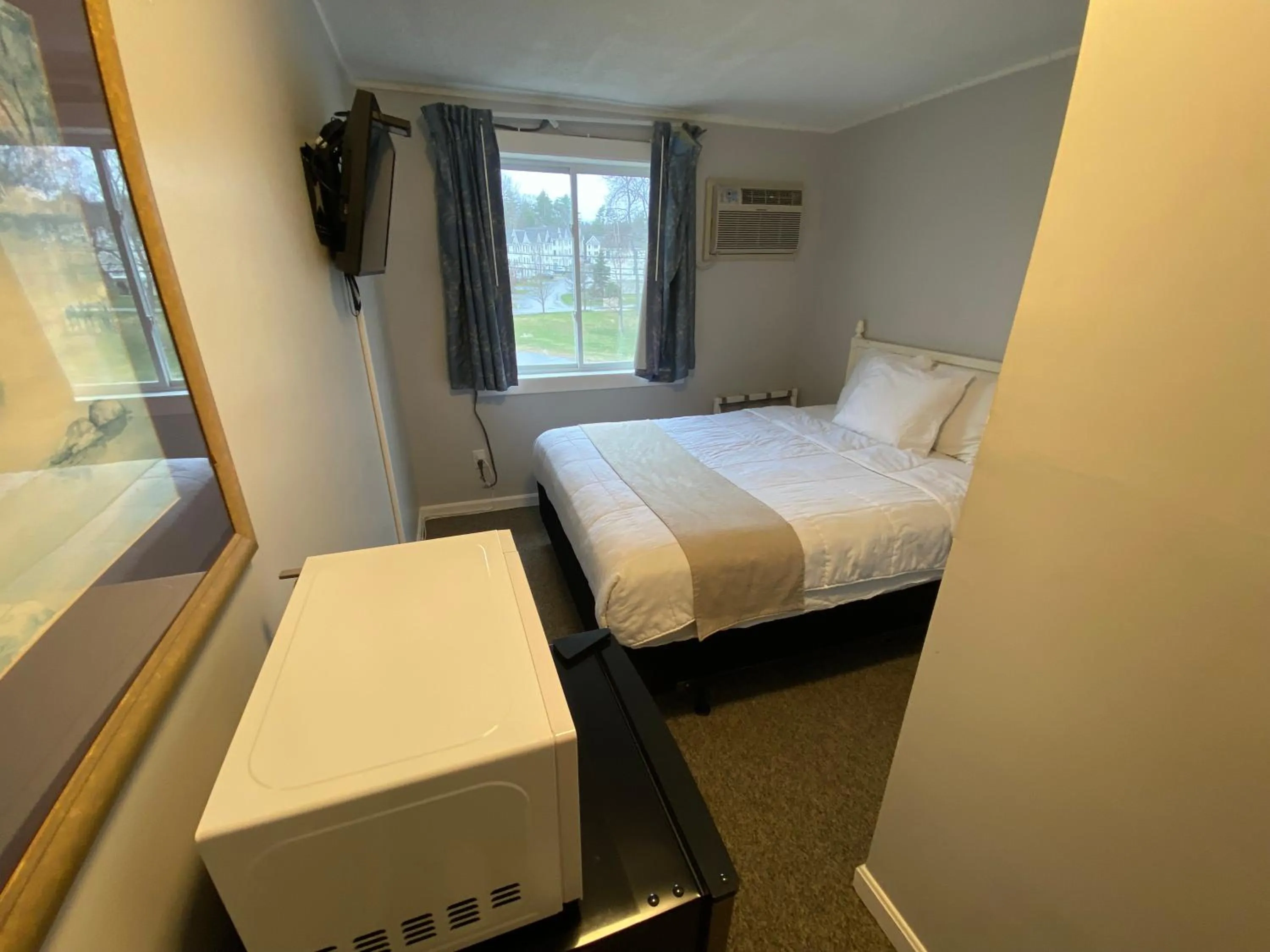 Bed in Winnisquam Lake Inn