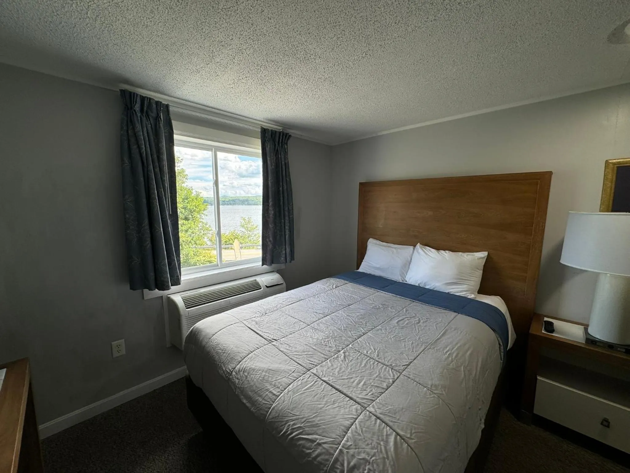 Bed in Winnisquam Lake Inn