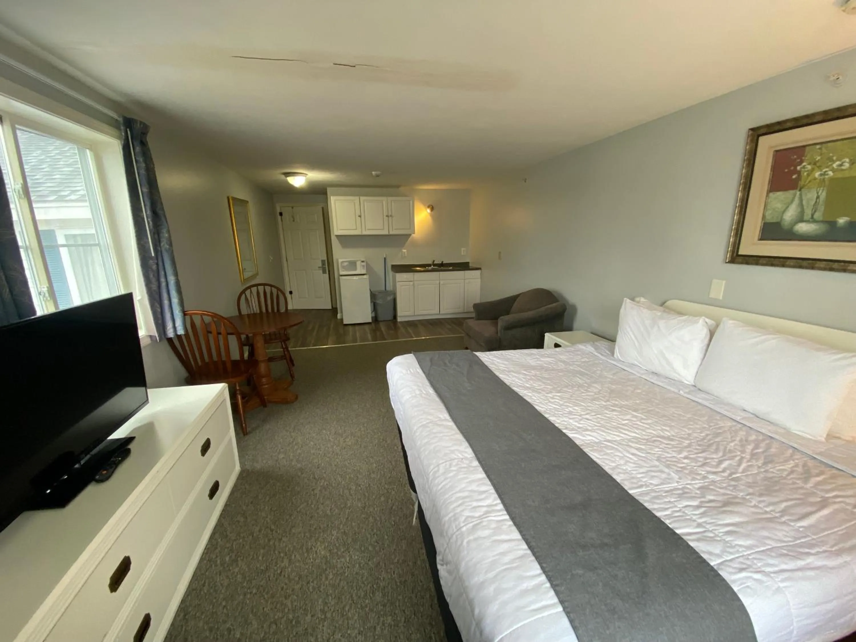 Bed in Winnisquam Lake Inn