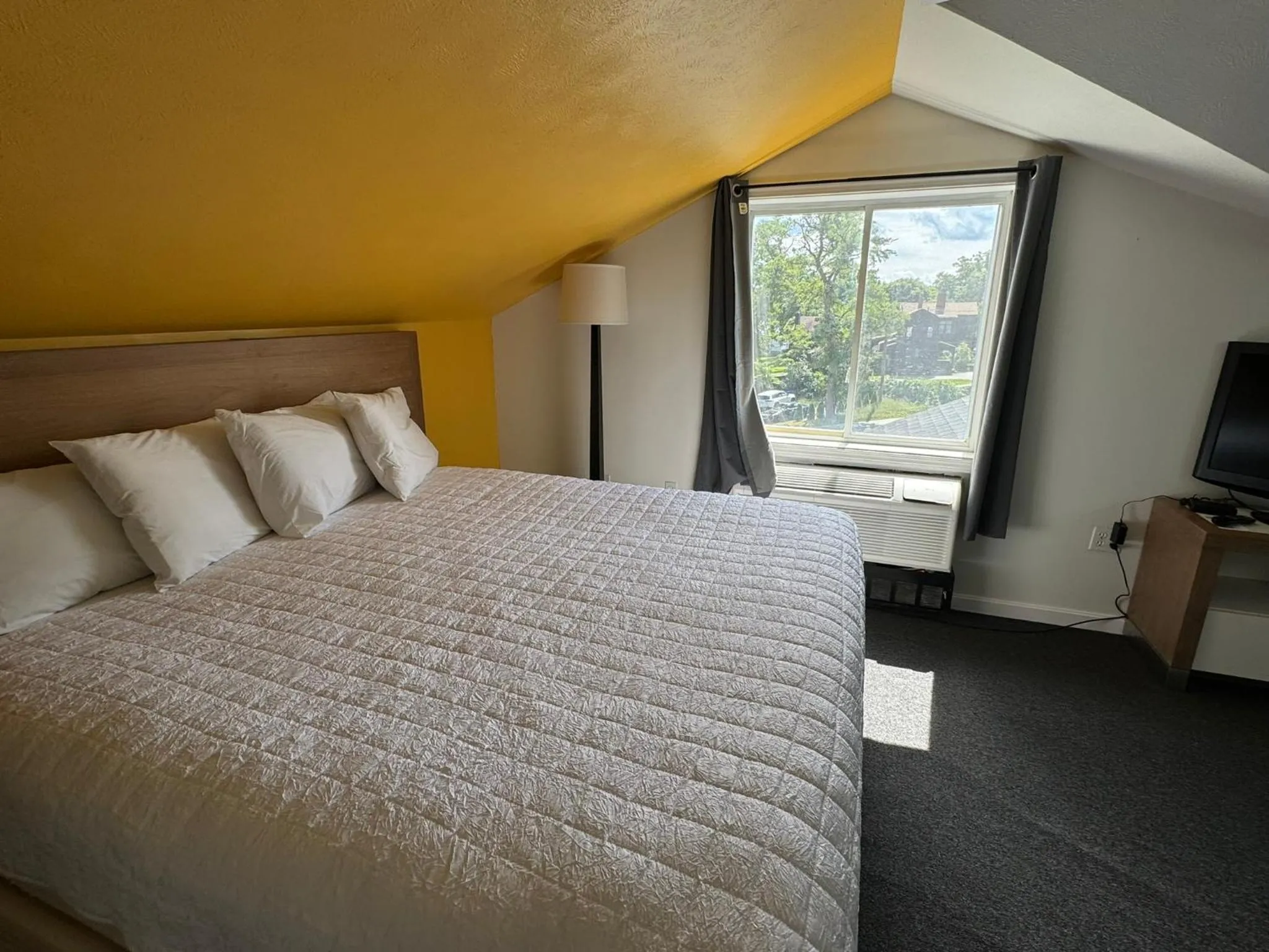 Bed in Winnisquam Lake Inn