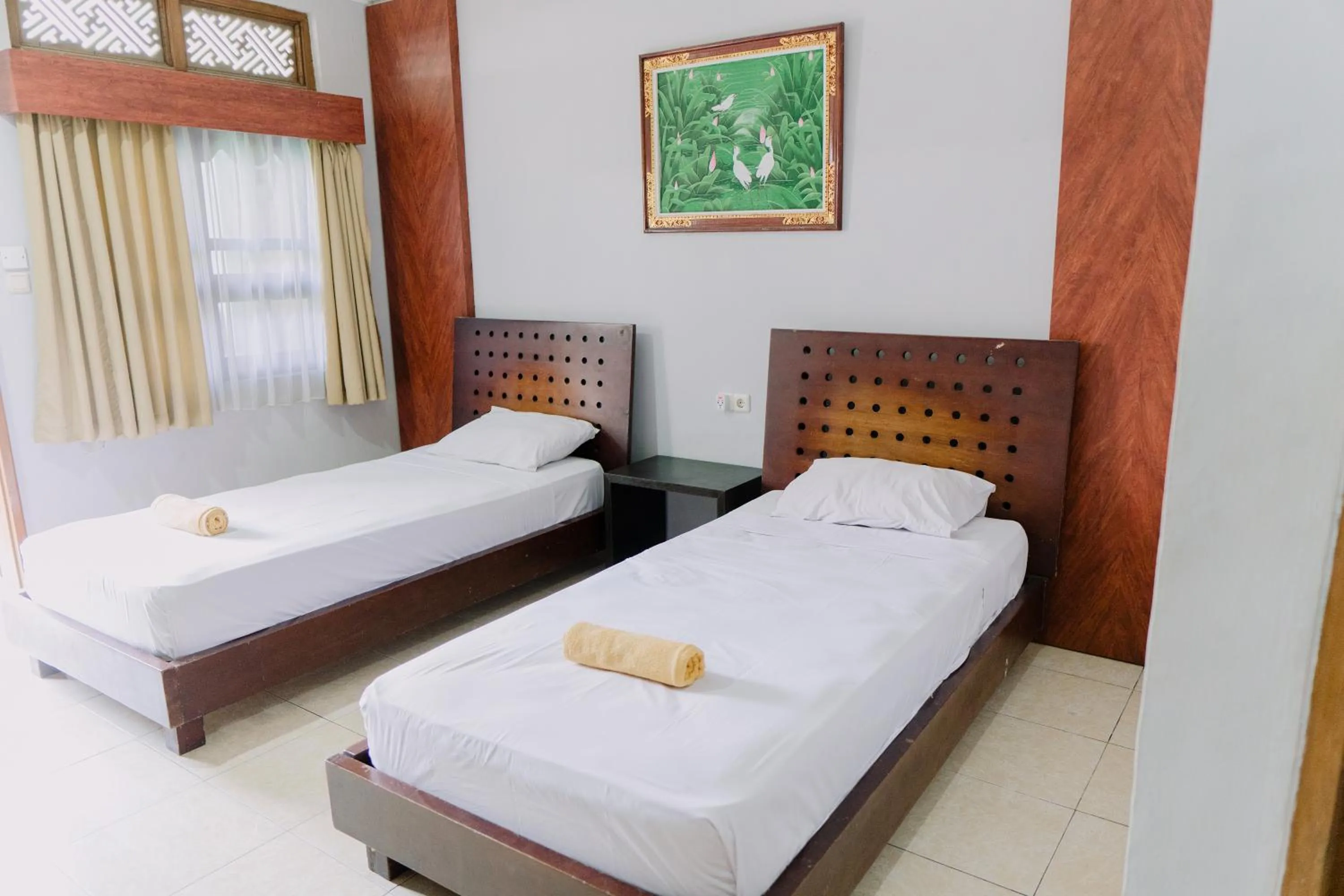 Bed in Gemini Star Hotel Kuta