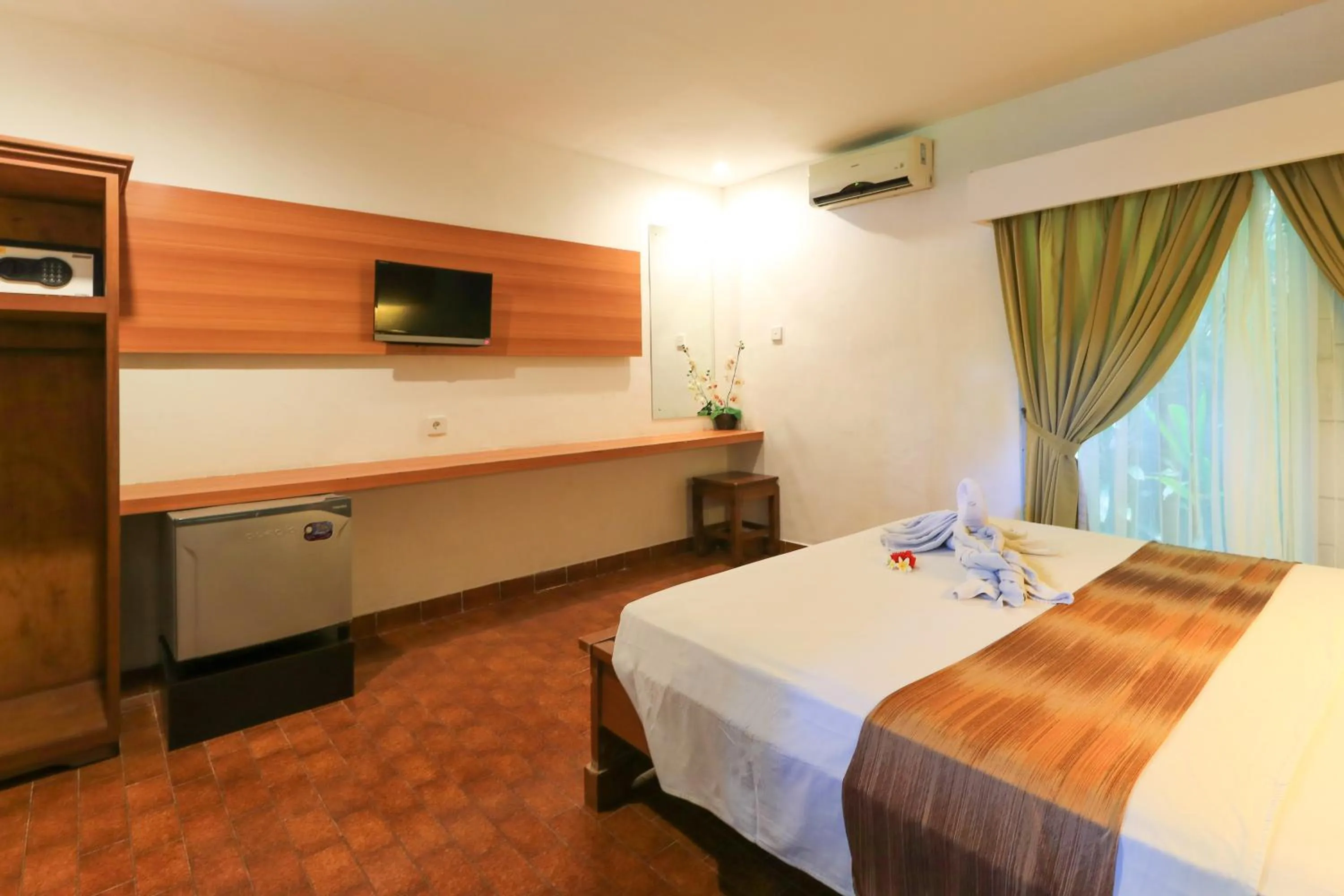 Photo of the whole room, Bed in Ayu Lili Garden Hotel Kuta