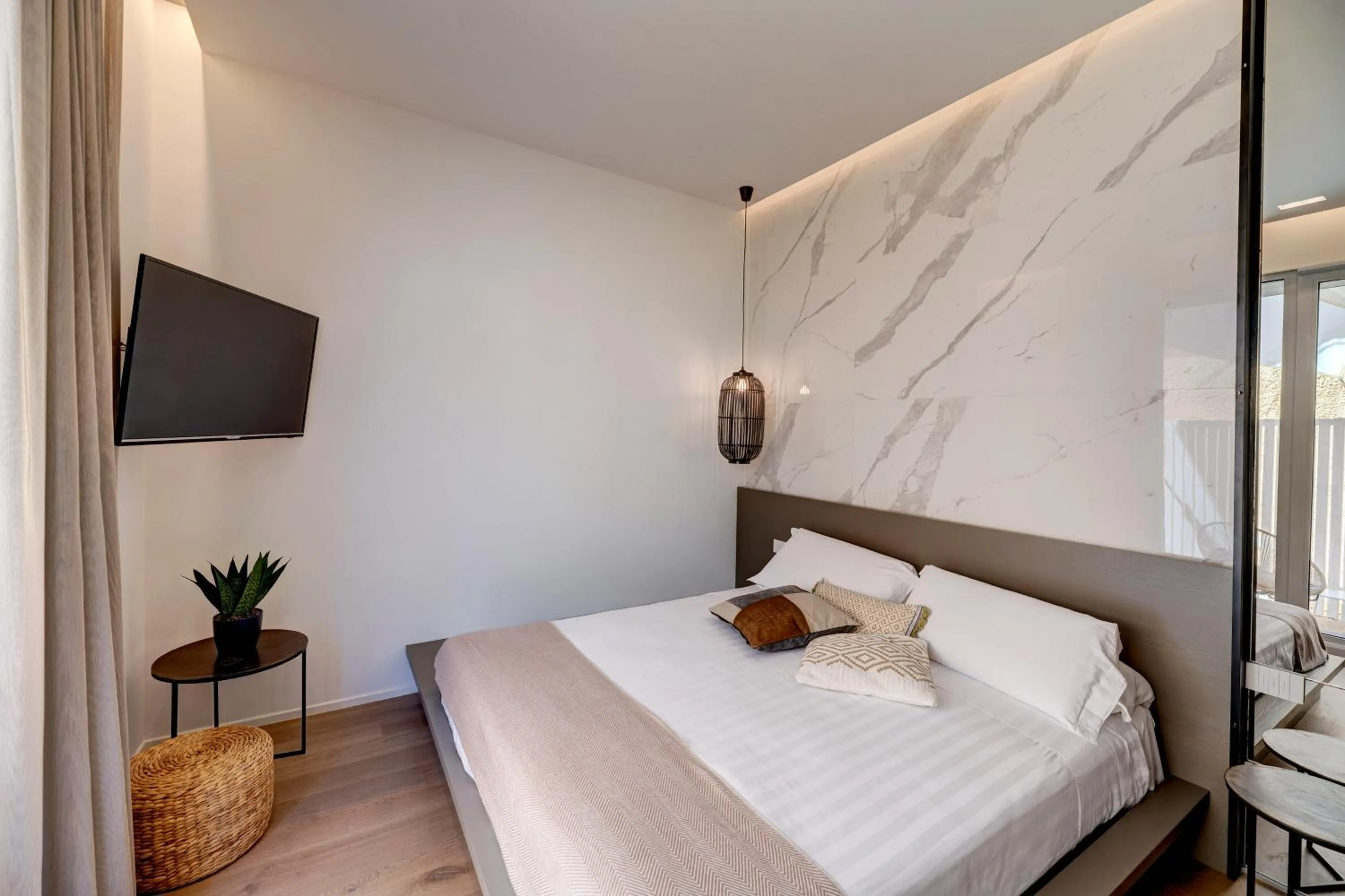 Bed in Le Palmette Suites