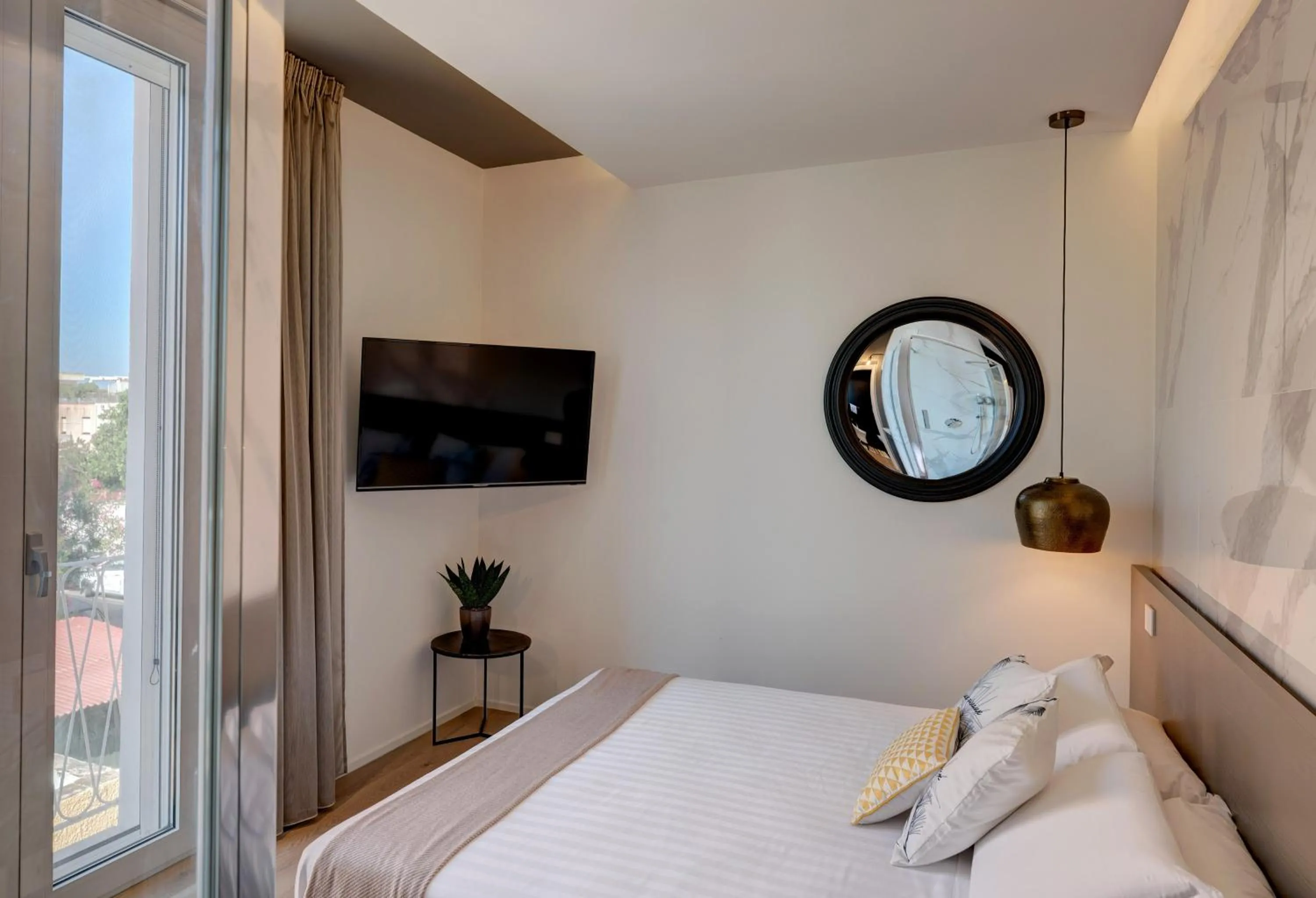 Bed in Le Palmette Suites