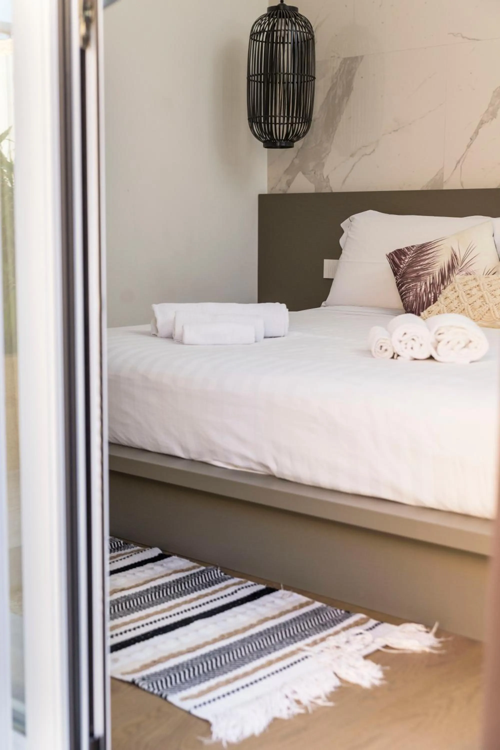 Bed in Le Palmette Suites