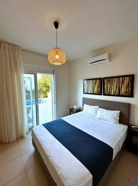 Bed in Azure Beach Villas