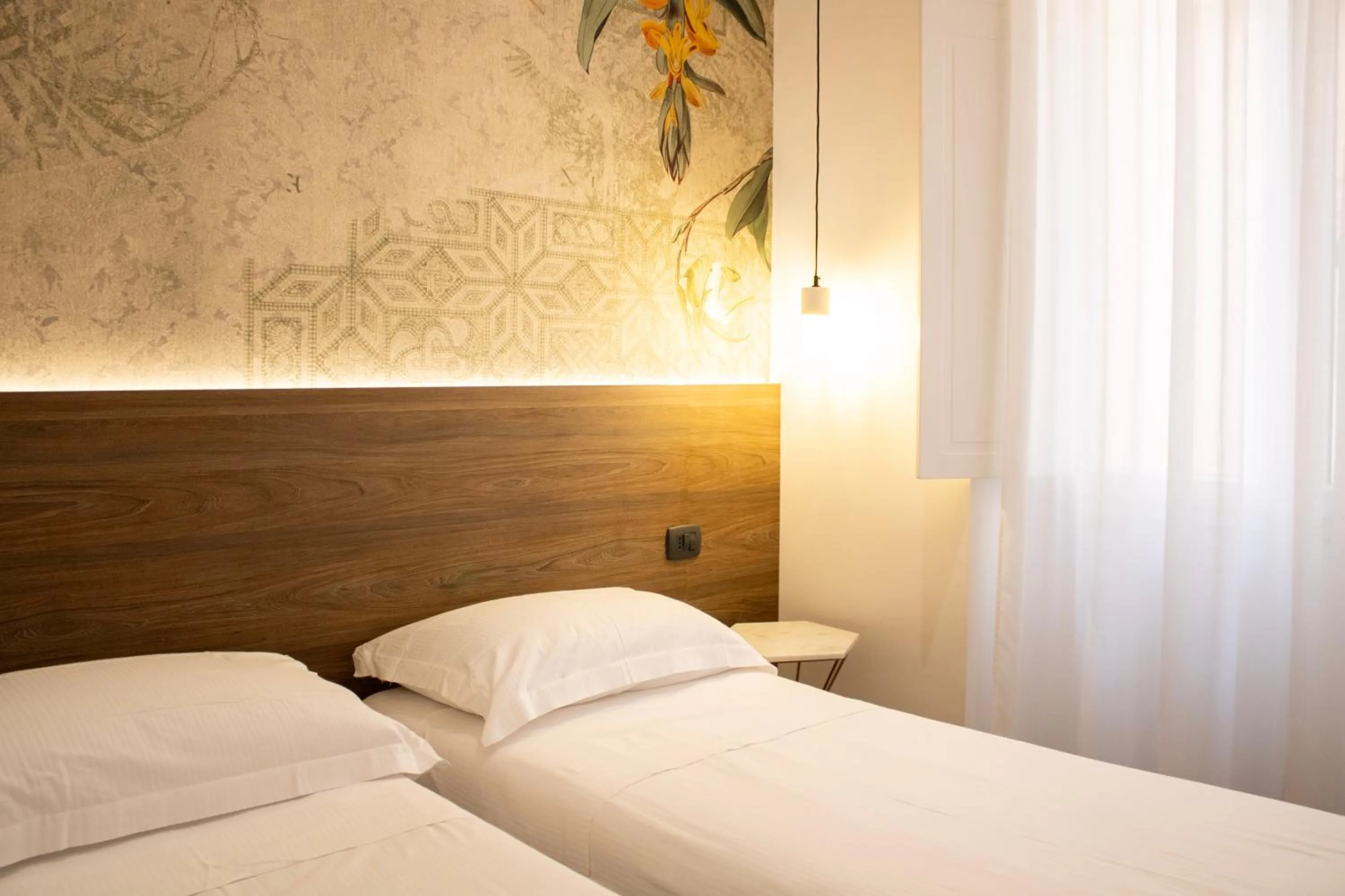 Bed in BADIA NUOVA Apart Hotel