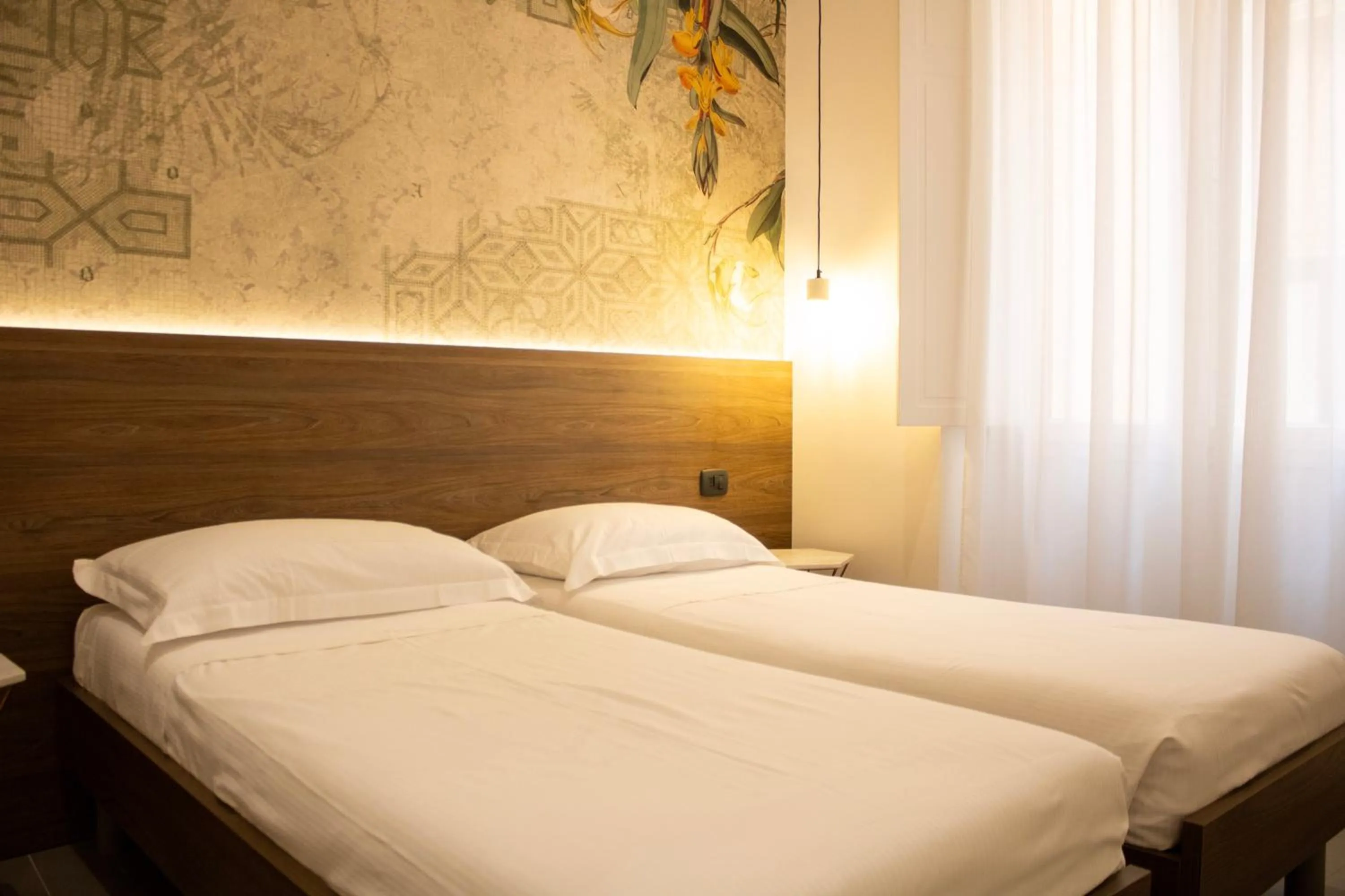 Bed in BADIA NUOVA Apart Hotel