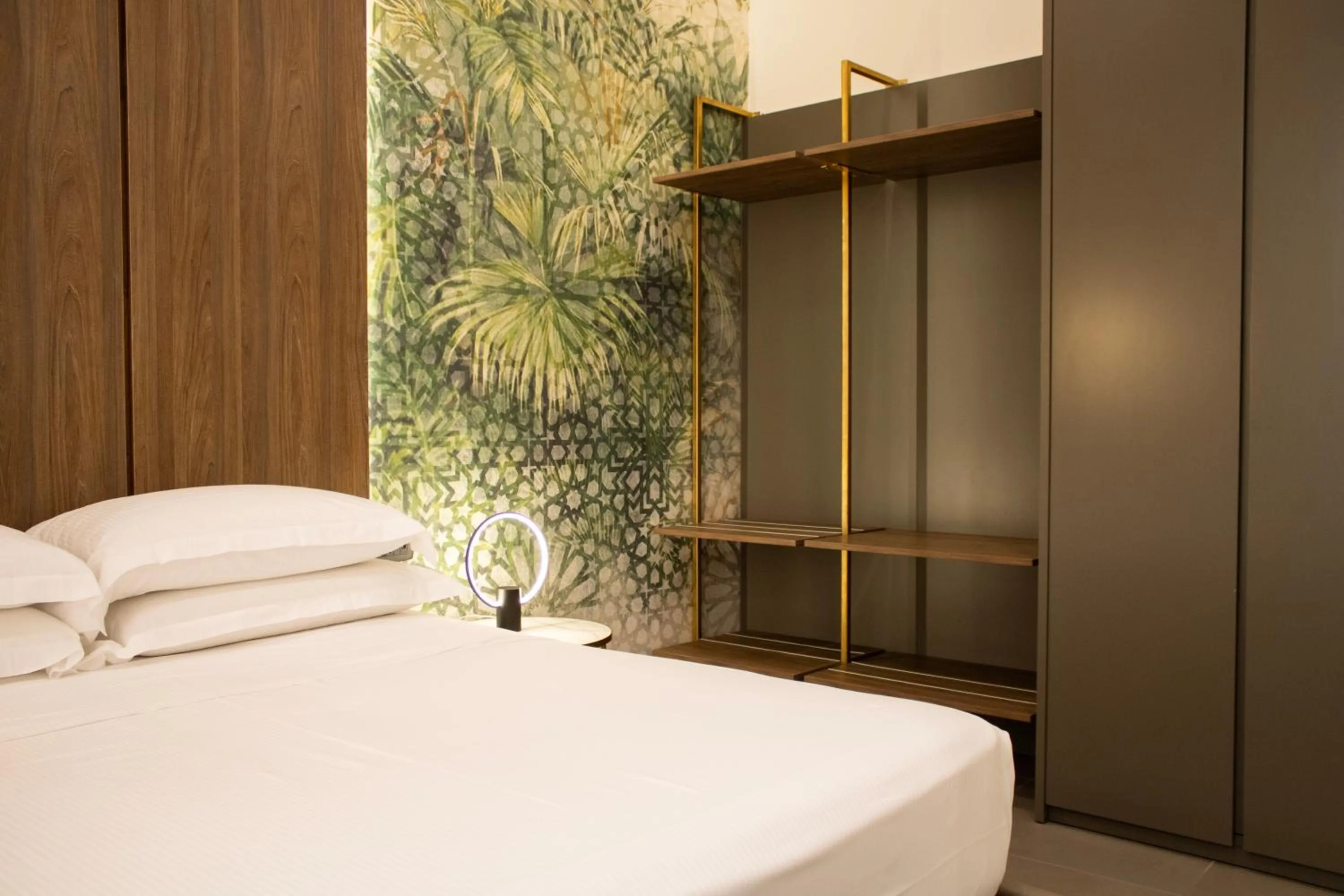 Bed in BADIA NUOVA Apart Hotel