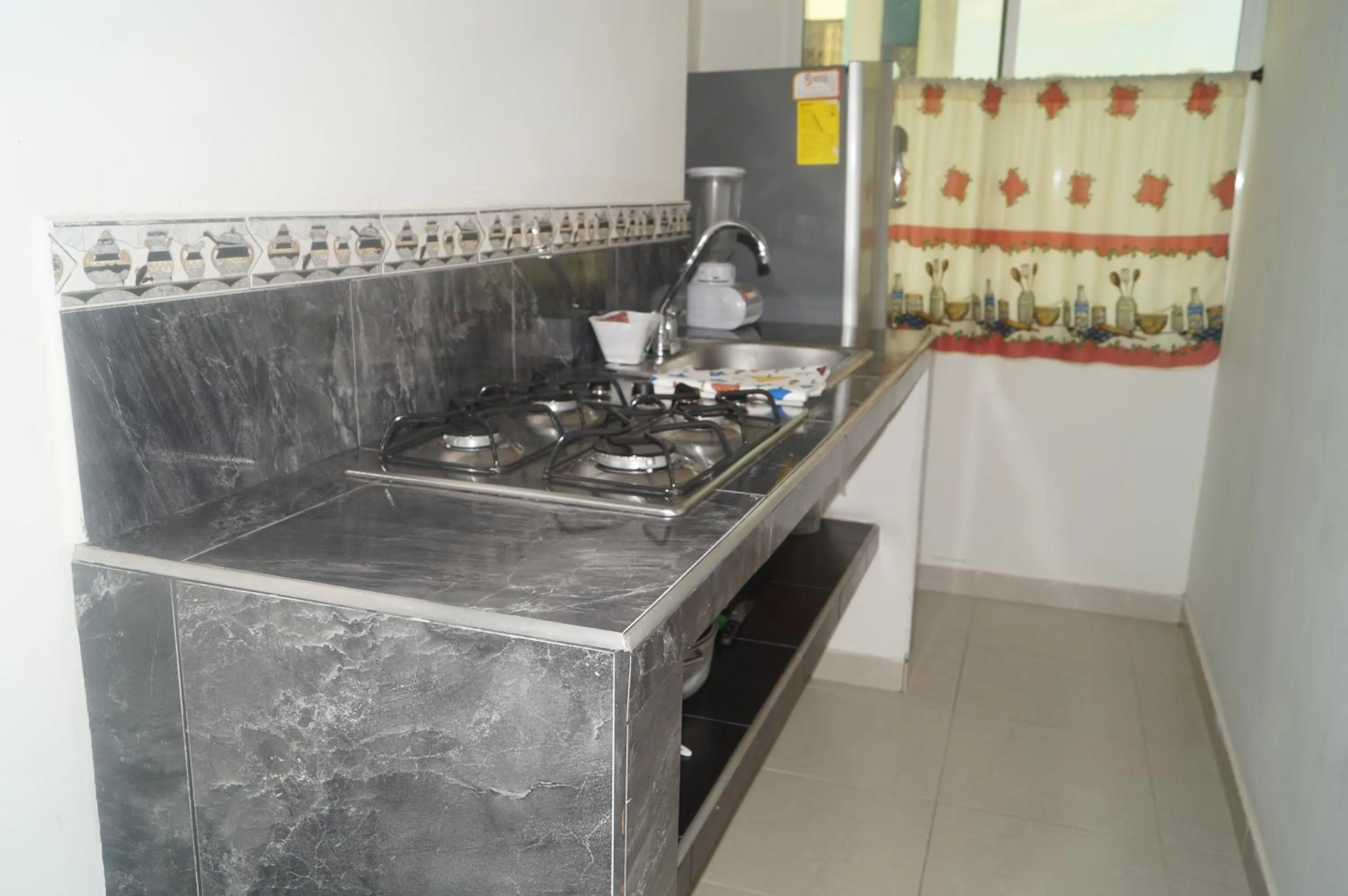 Kitchen or kitchenette in Apartahotel Tukasa Rodadero