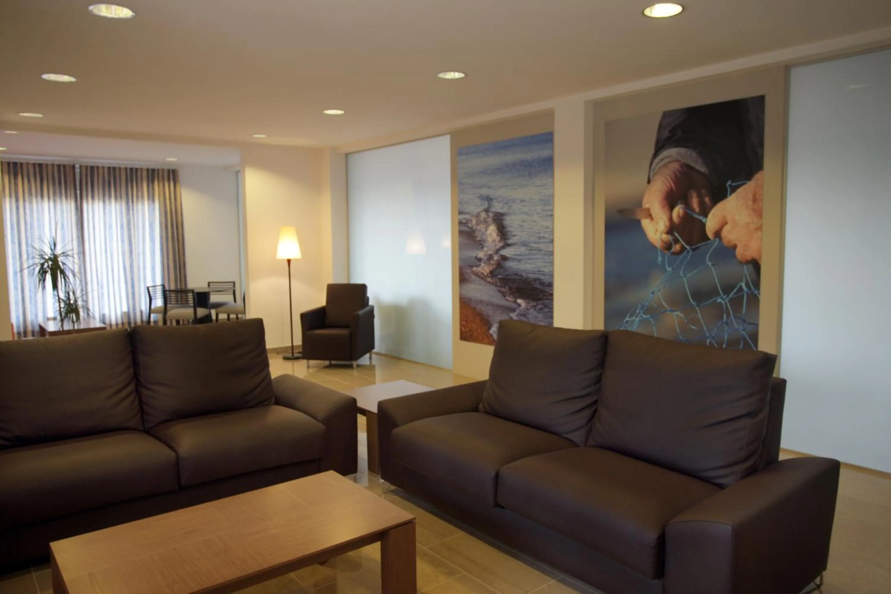 Communal lounge/ TV room in Hotel Sa Riera