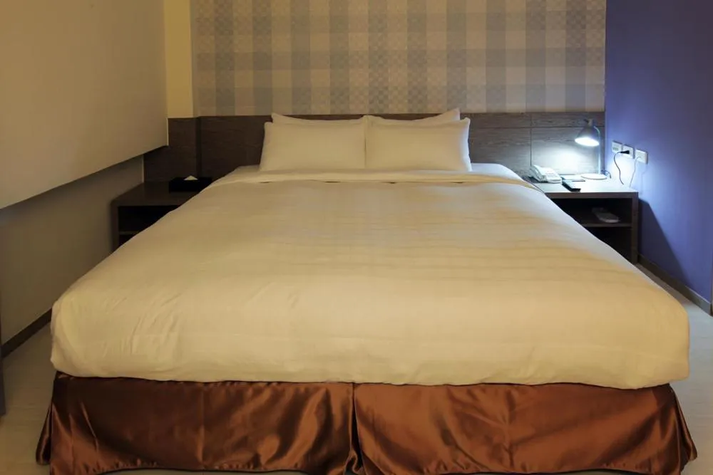 Bed in Nest Hotel