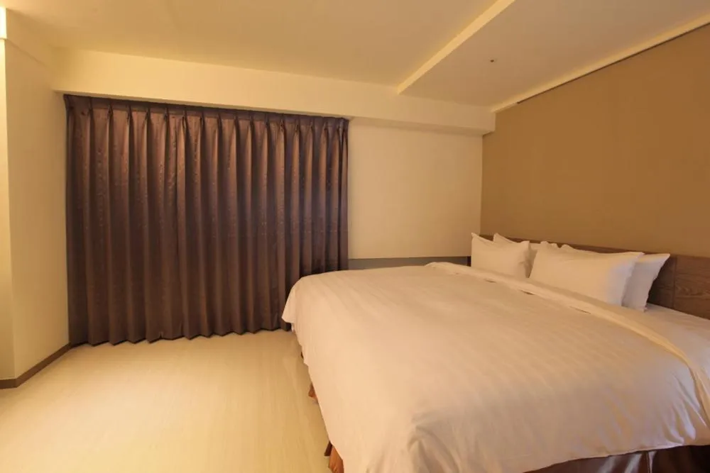 Bed in Nest Hotel