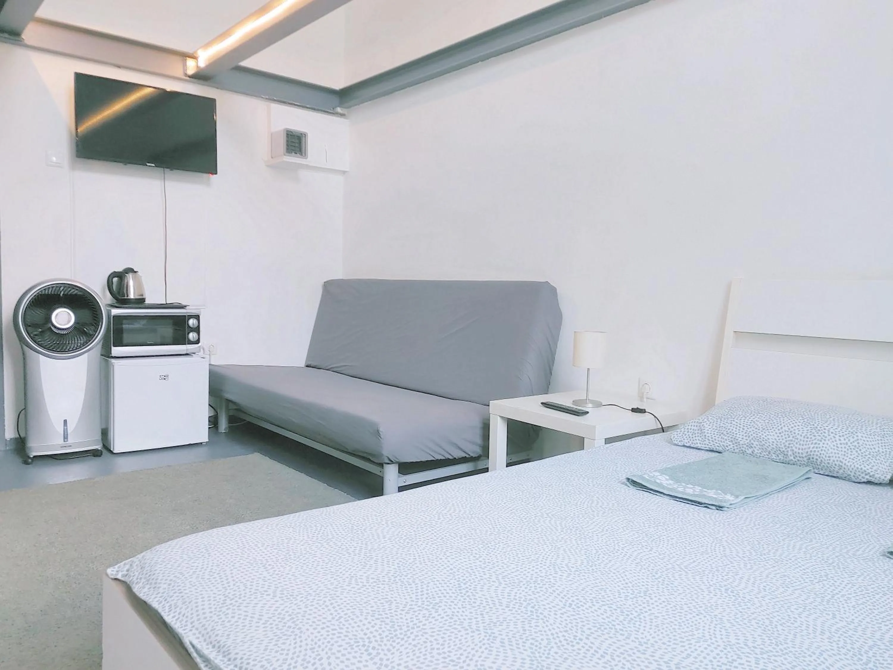 Bed in Sleepover City Center GuestRooms