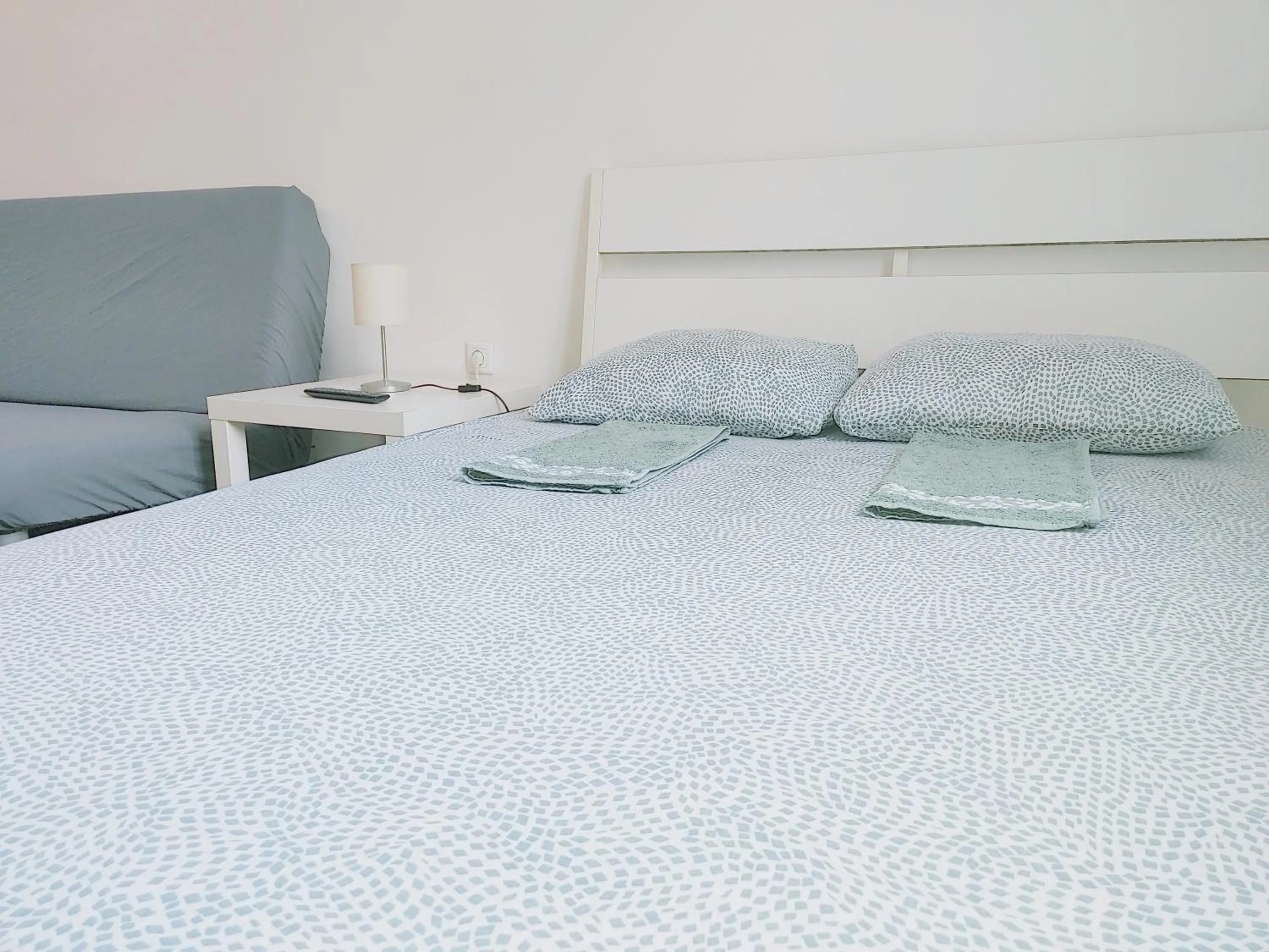Bed in Sleepover City Center GuestRooms