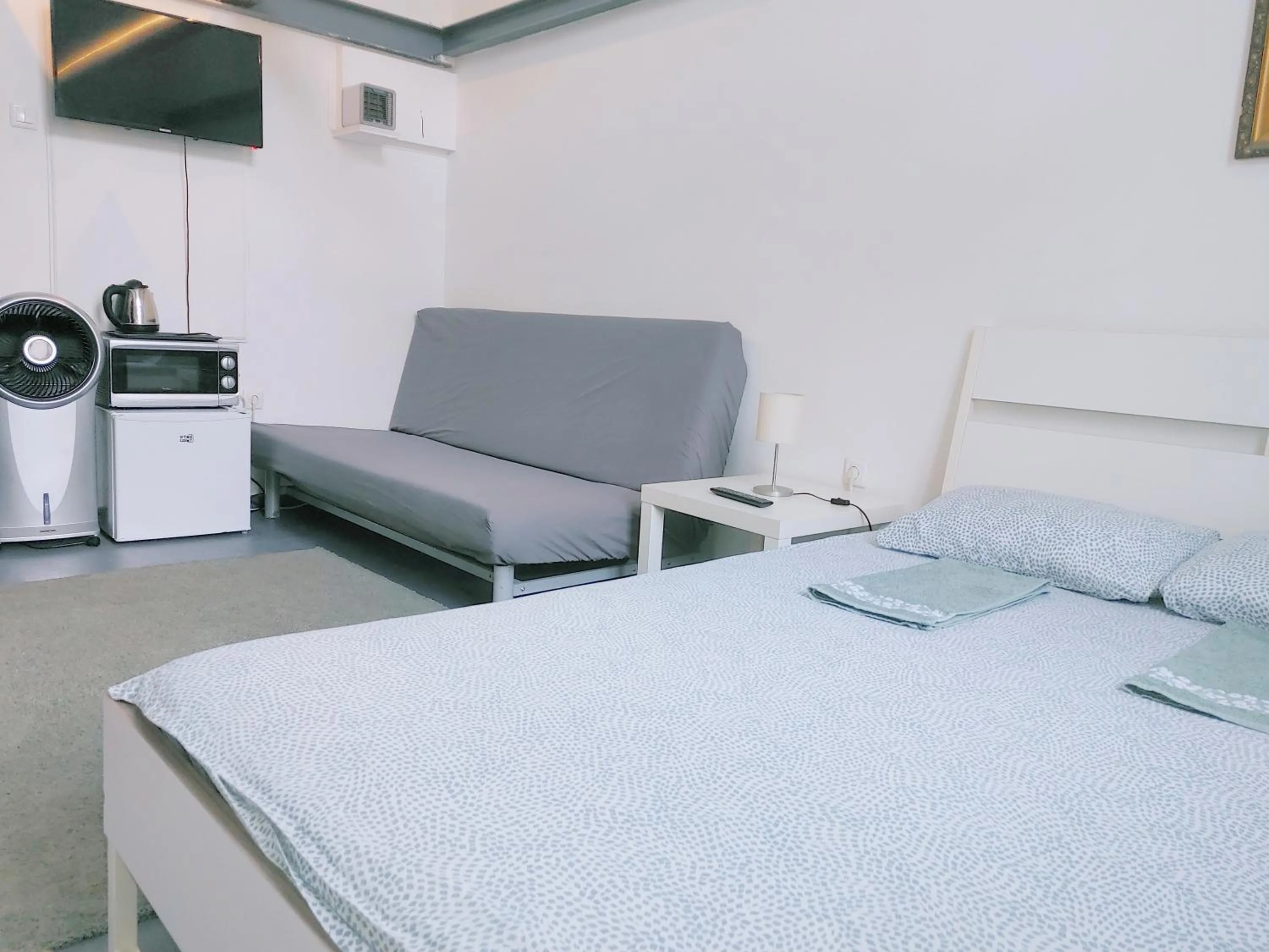 Bed in Sleepover City Center GuestRooms