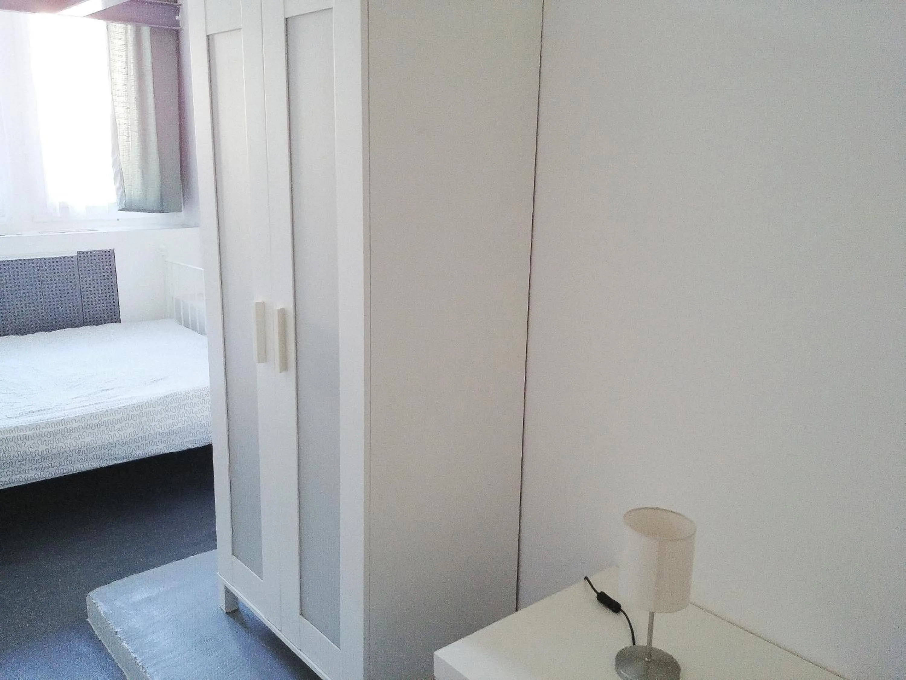 Bed in Sleepover City Center GuestRooms