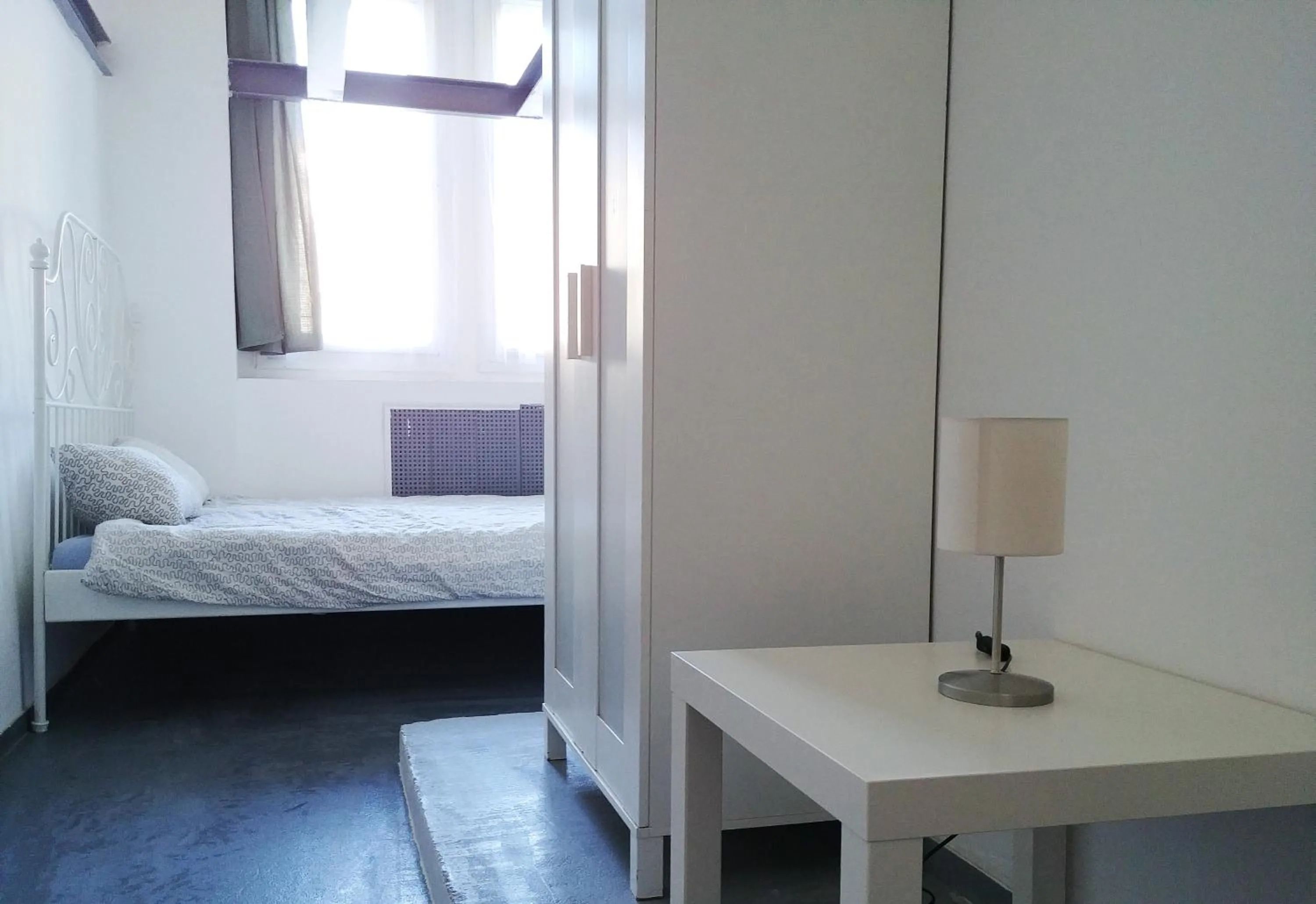 Bed in Sleepover City Center GuestRooms