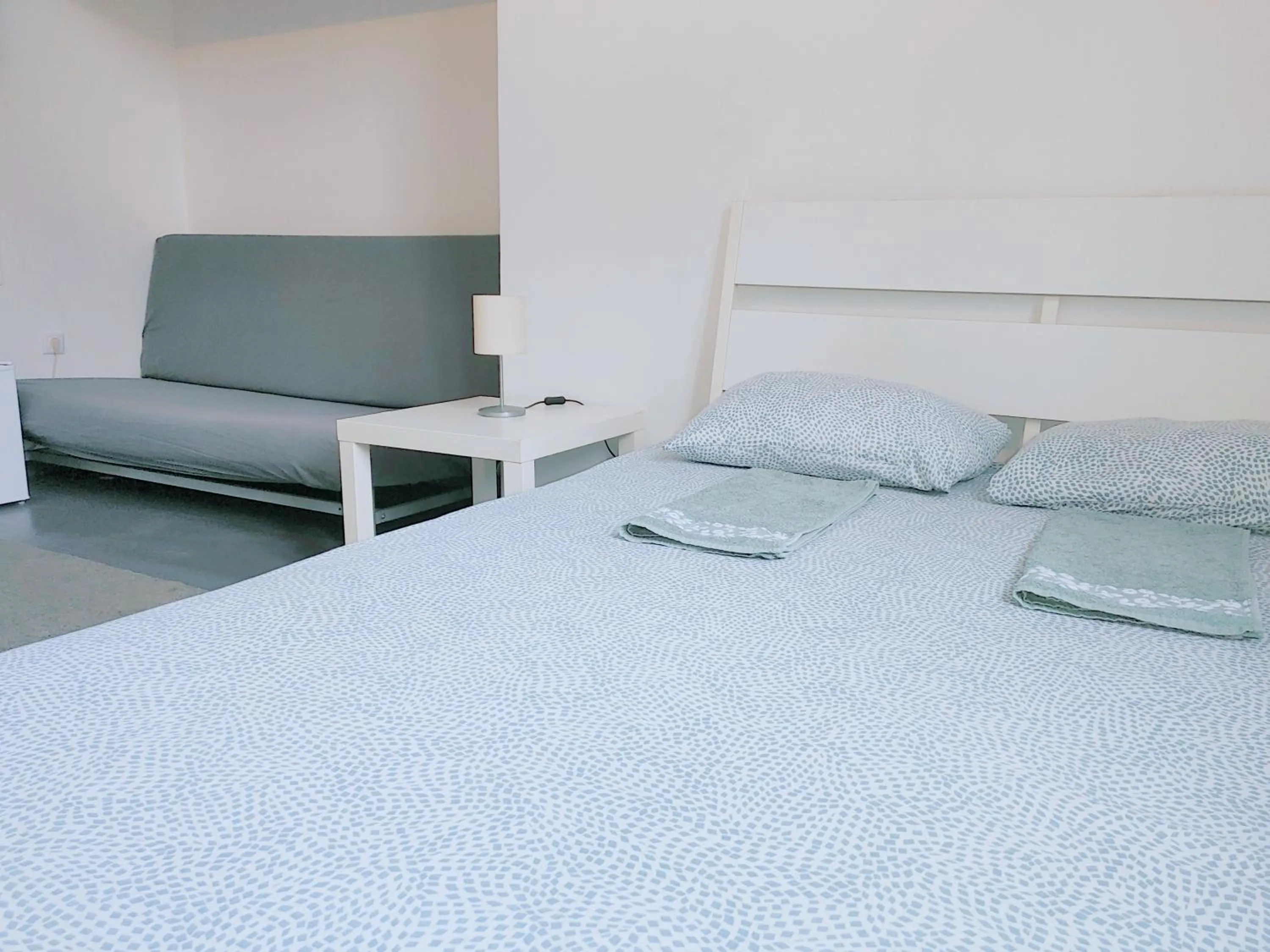 Bed in Sleepover City Center GuestRooms