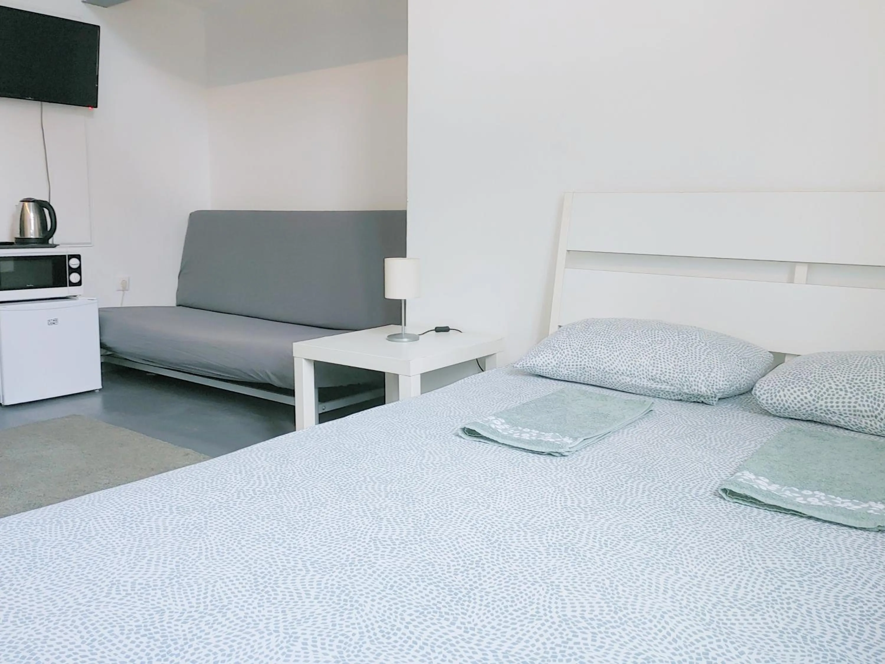 Bed in Sleepover City Center GuestRooms