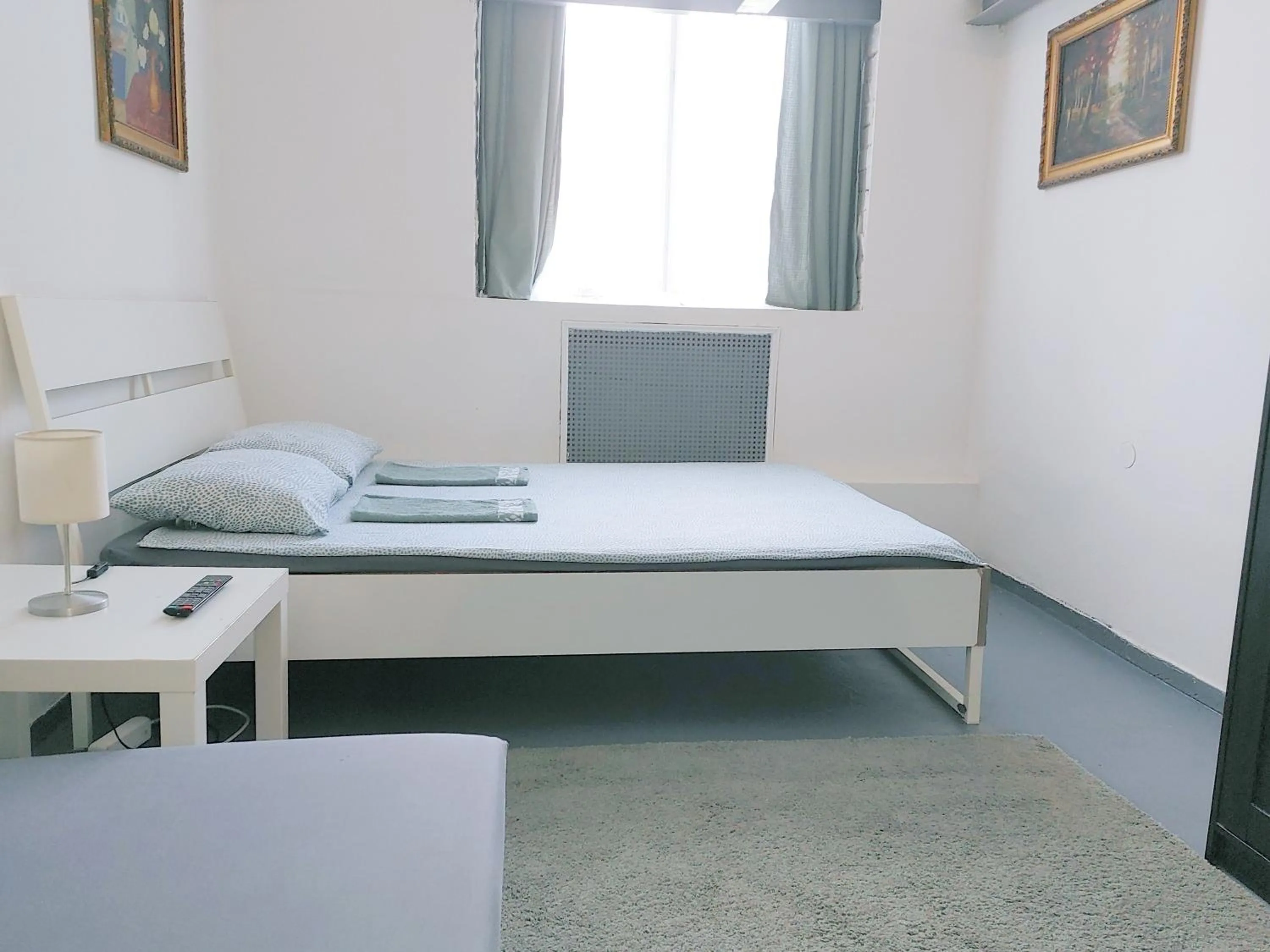 Bed in Sleepover City Center GuestRooms