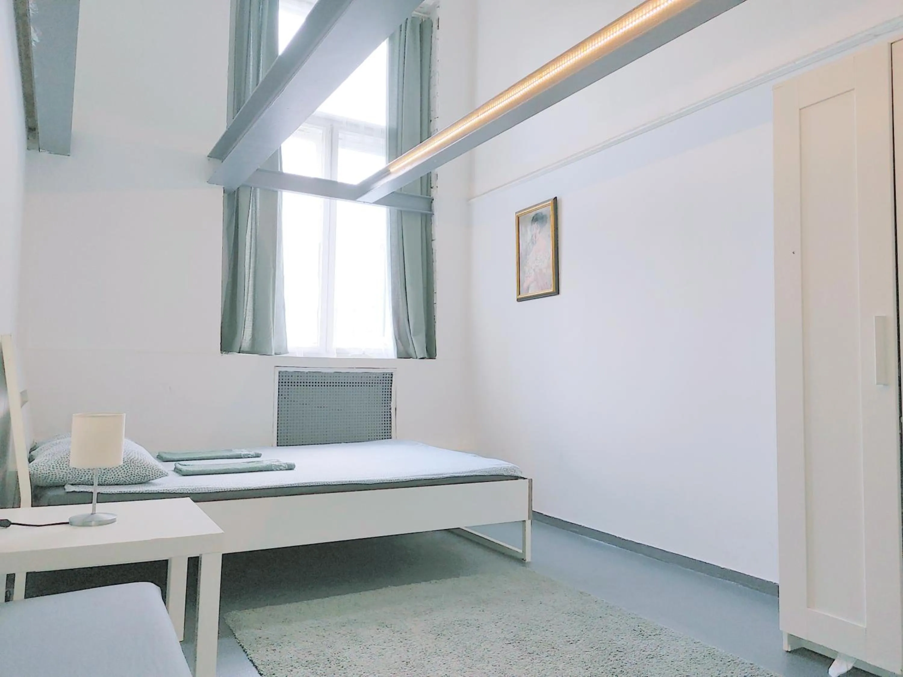 Bed in Sleepover City Center GuestRooms