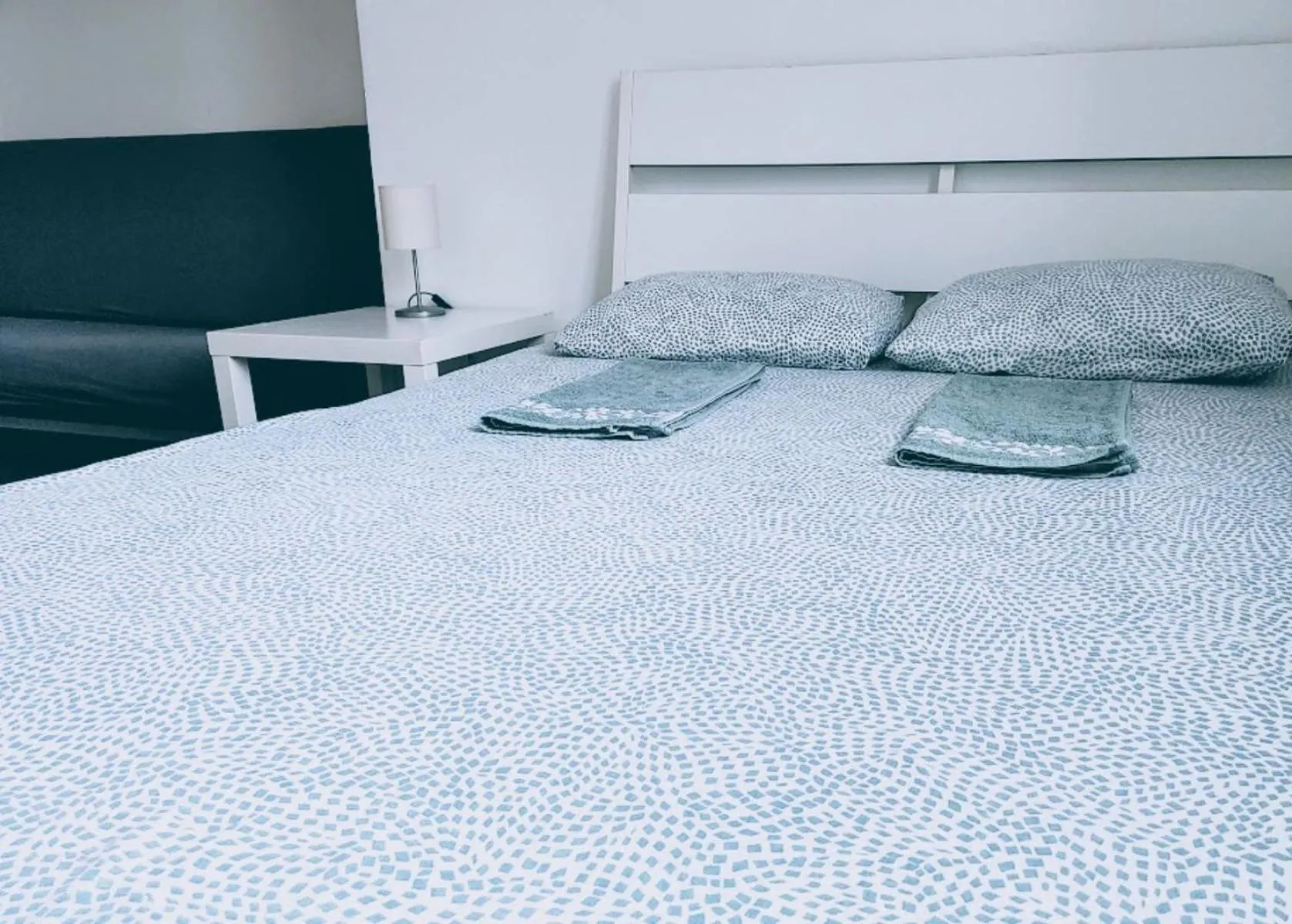 Bed in Sleepover City Center GuestRooms