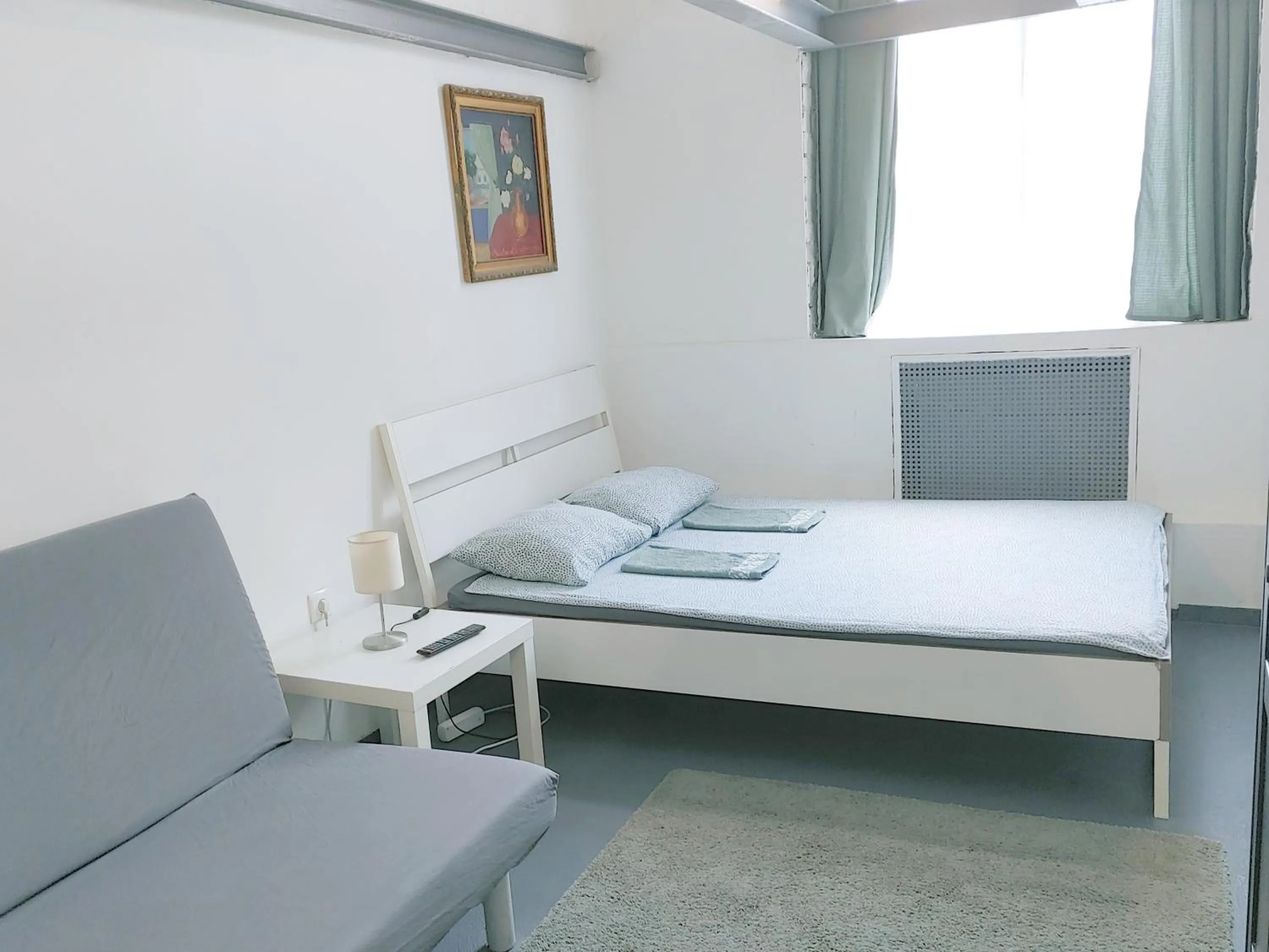 Bed in Sleepover City Center GuestRooms