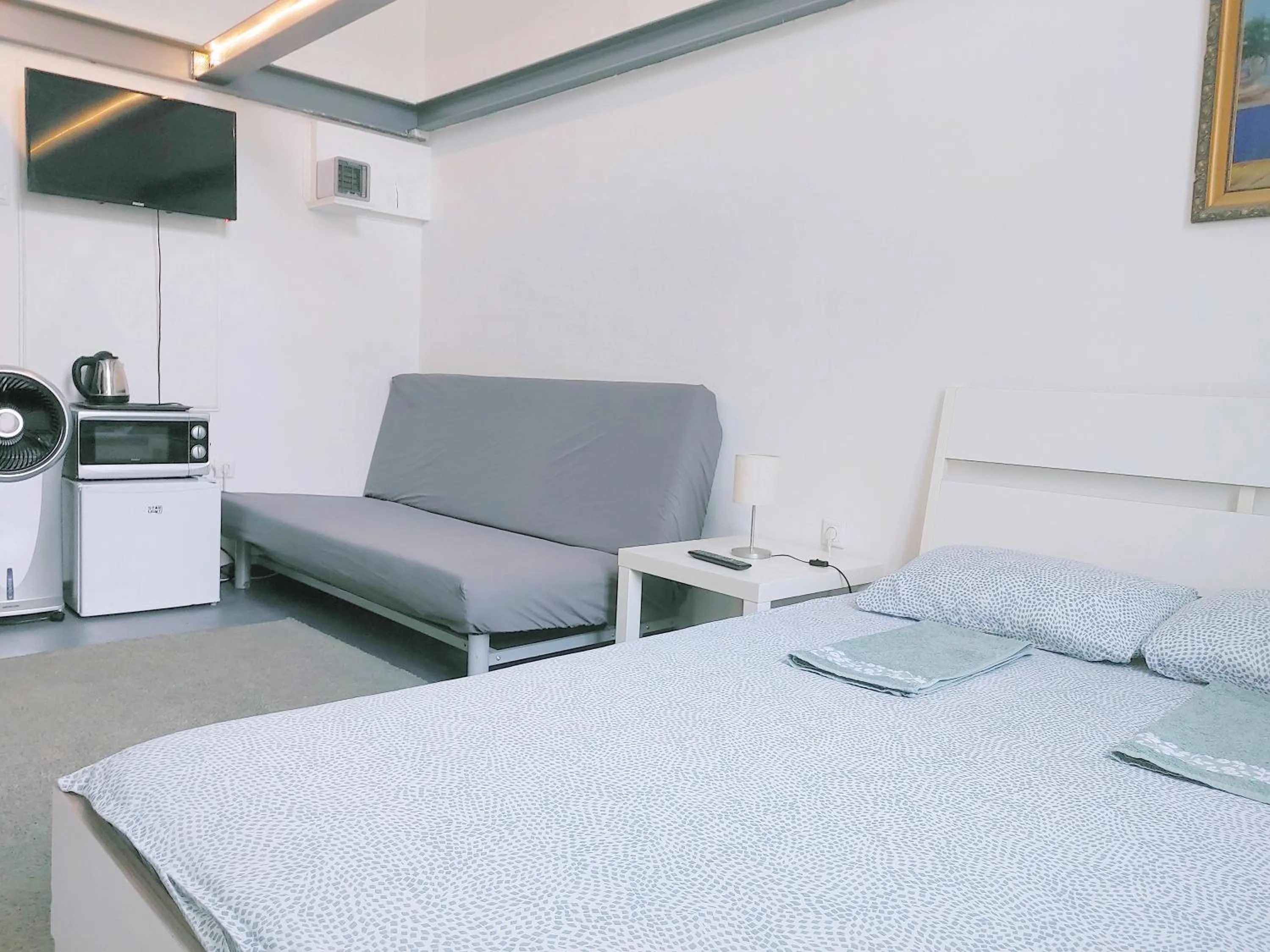 Bed in Sleepover City Center GuestRooms