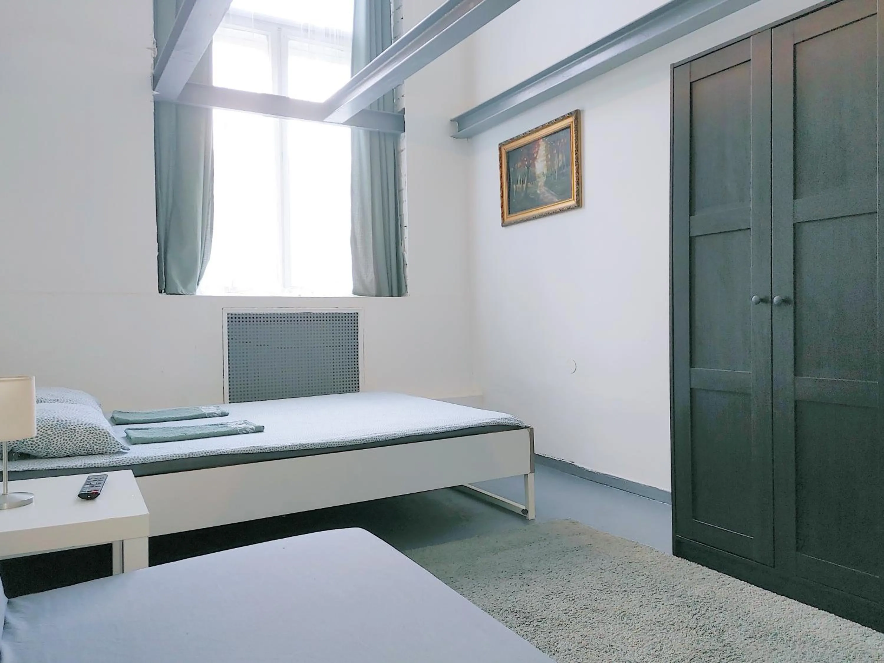 Bed in Sleepover City Center GuestRooms