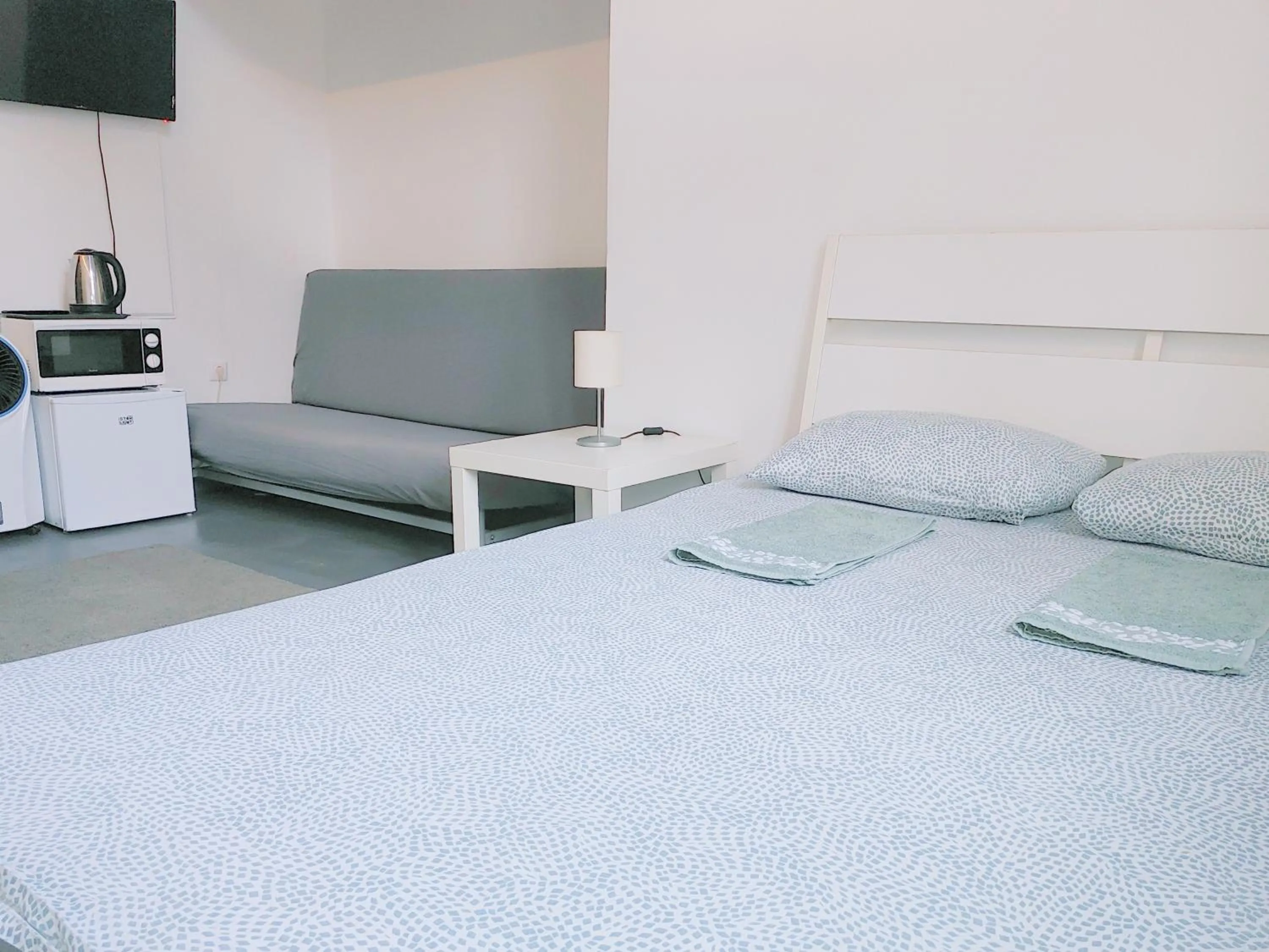 Bed in Sleepover City Center GuestRooms