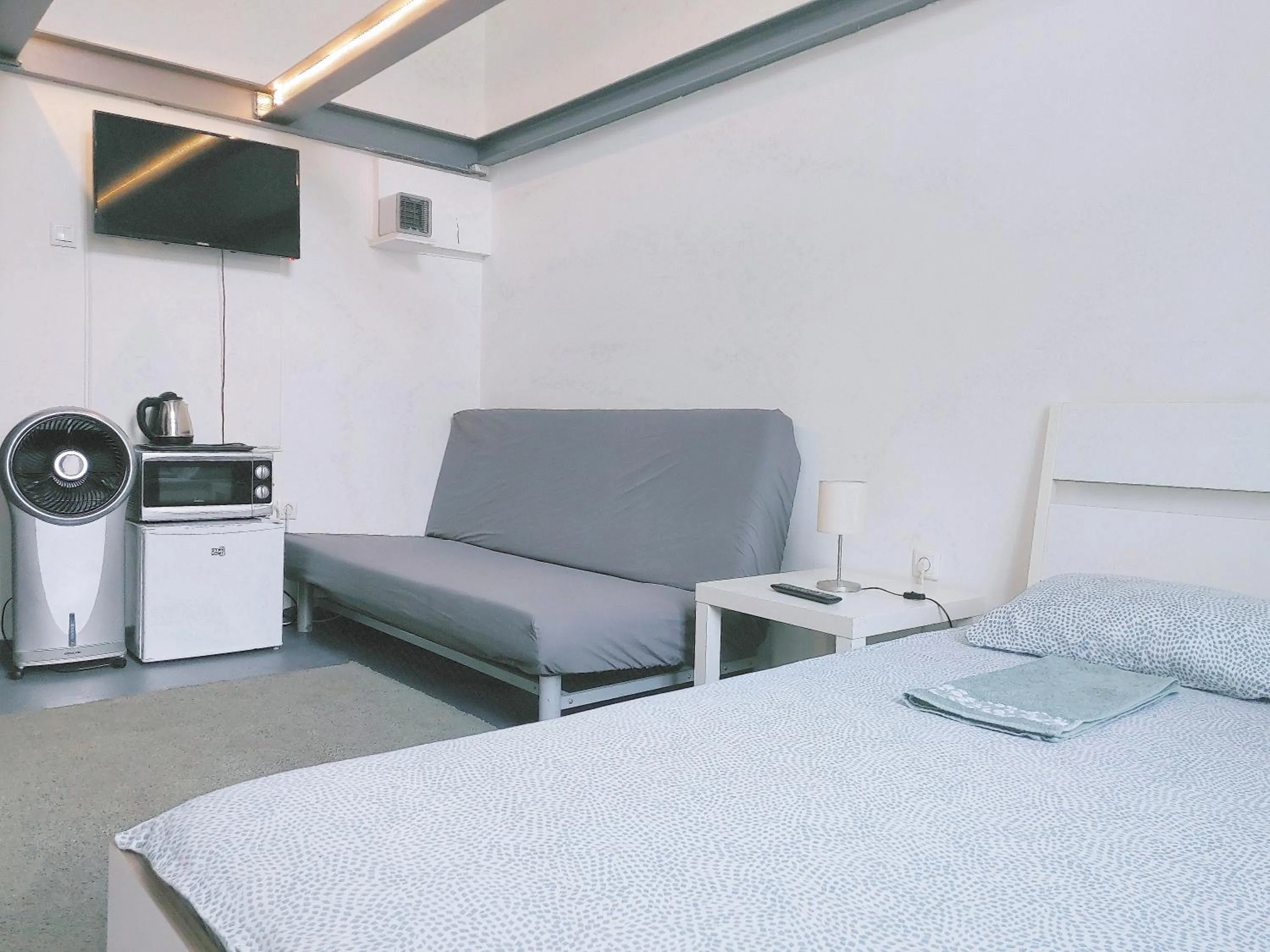Bed in Sleepover City Center GuestRooms